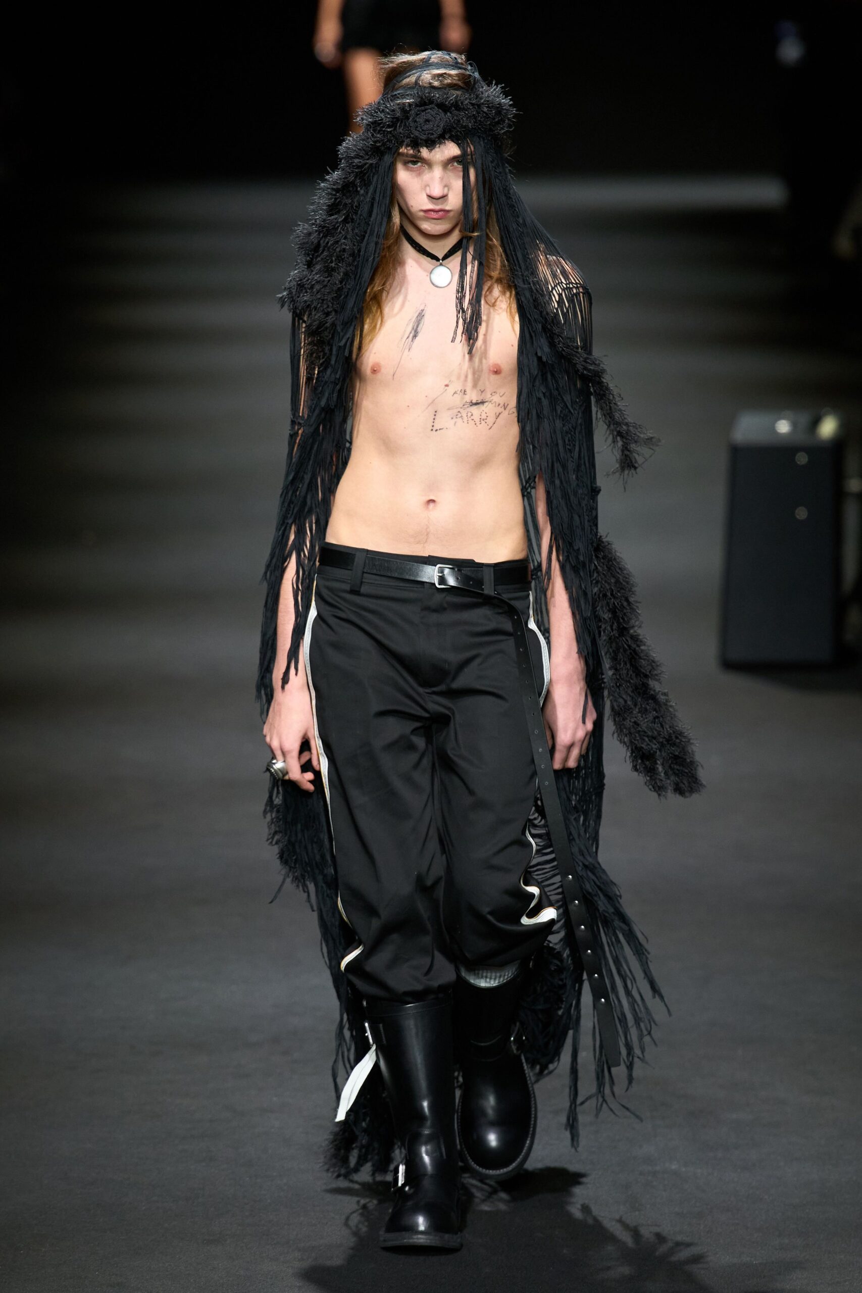 black fur cape with fitted pants