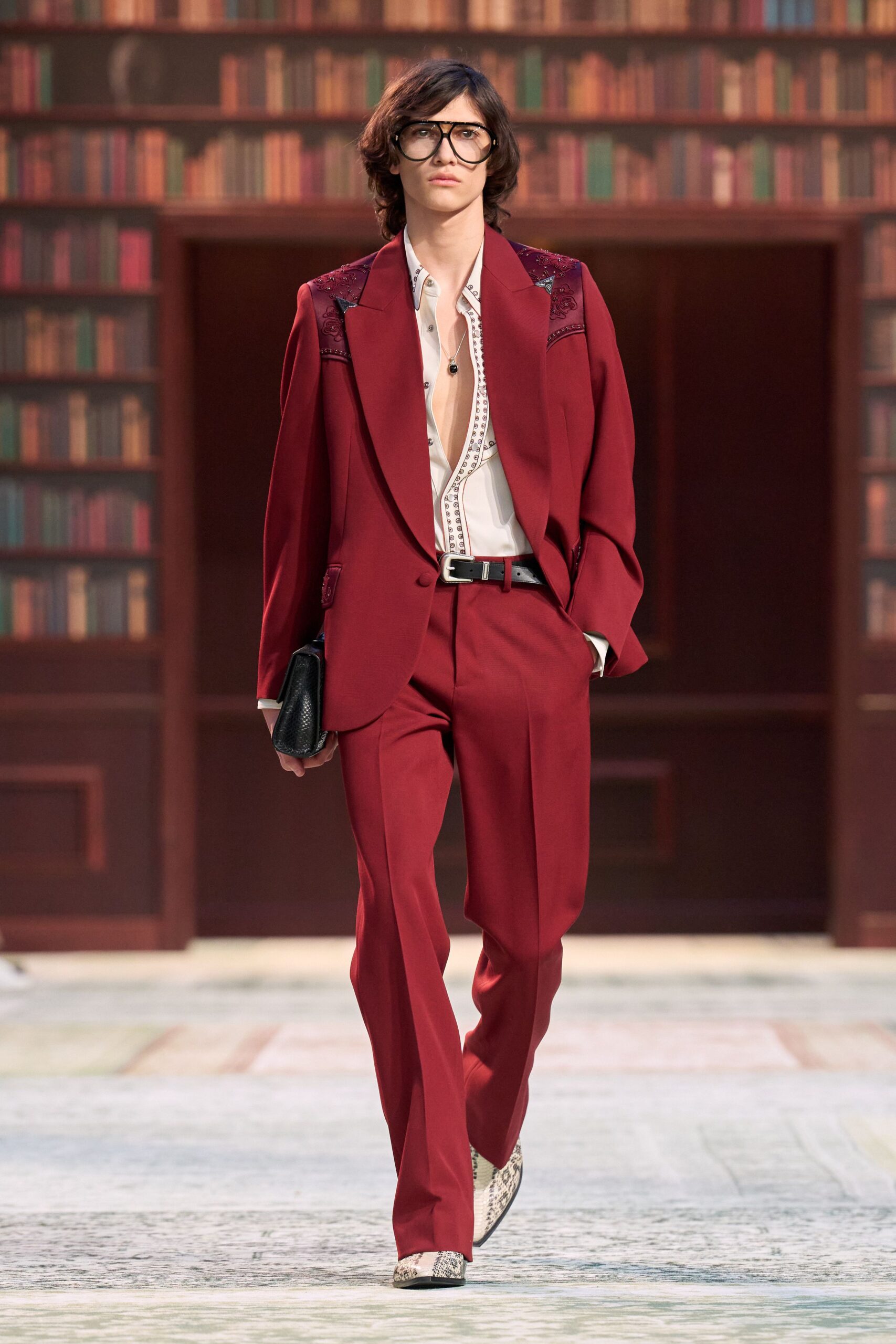 red tailored suit with embroidered shirt