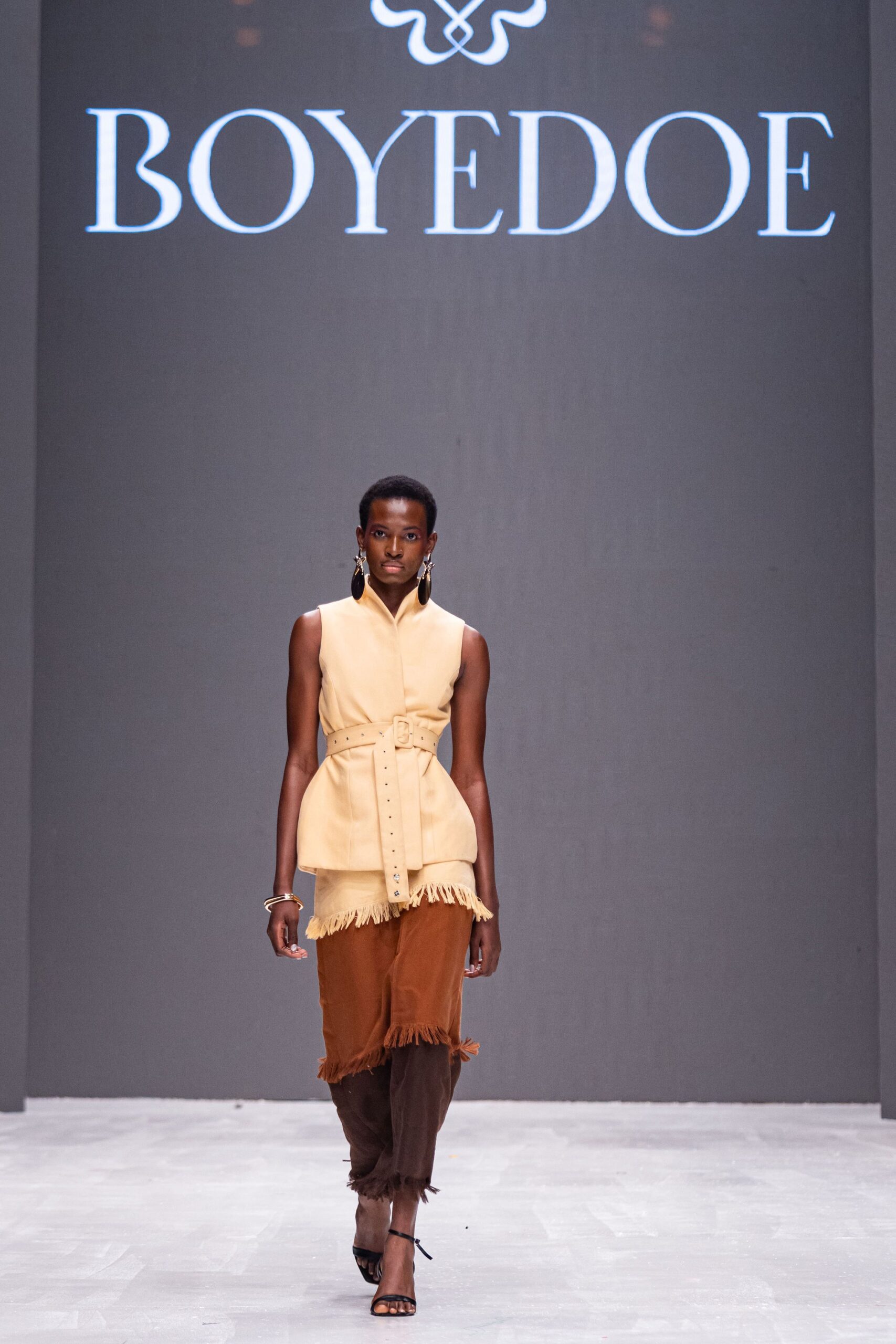 beige cotton sleeveless collared fitted fringed belted top
