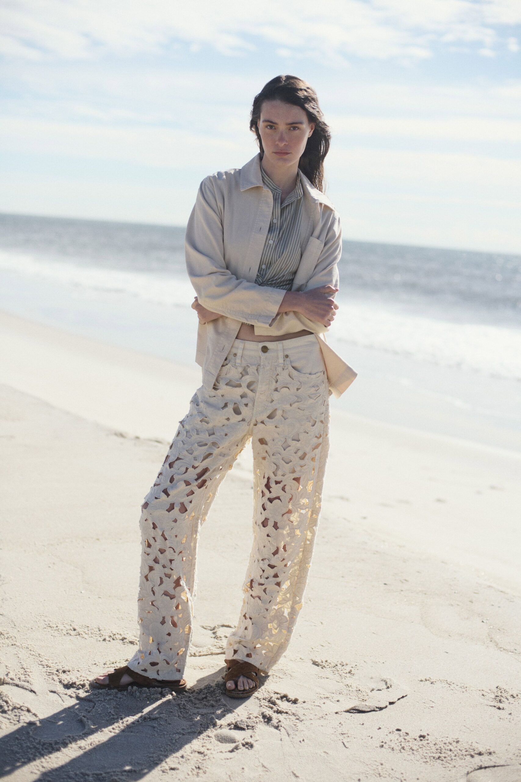beige jacket blue shirt white cutout pants