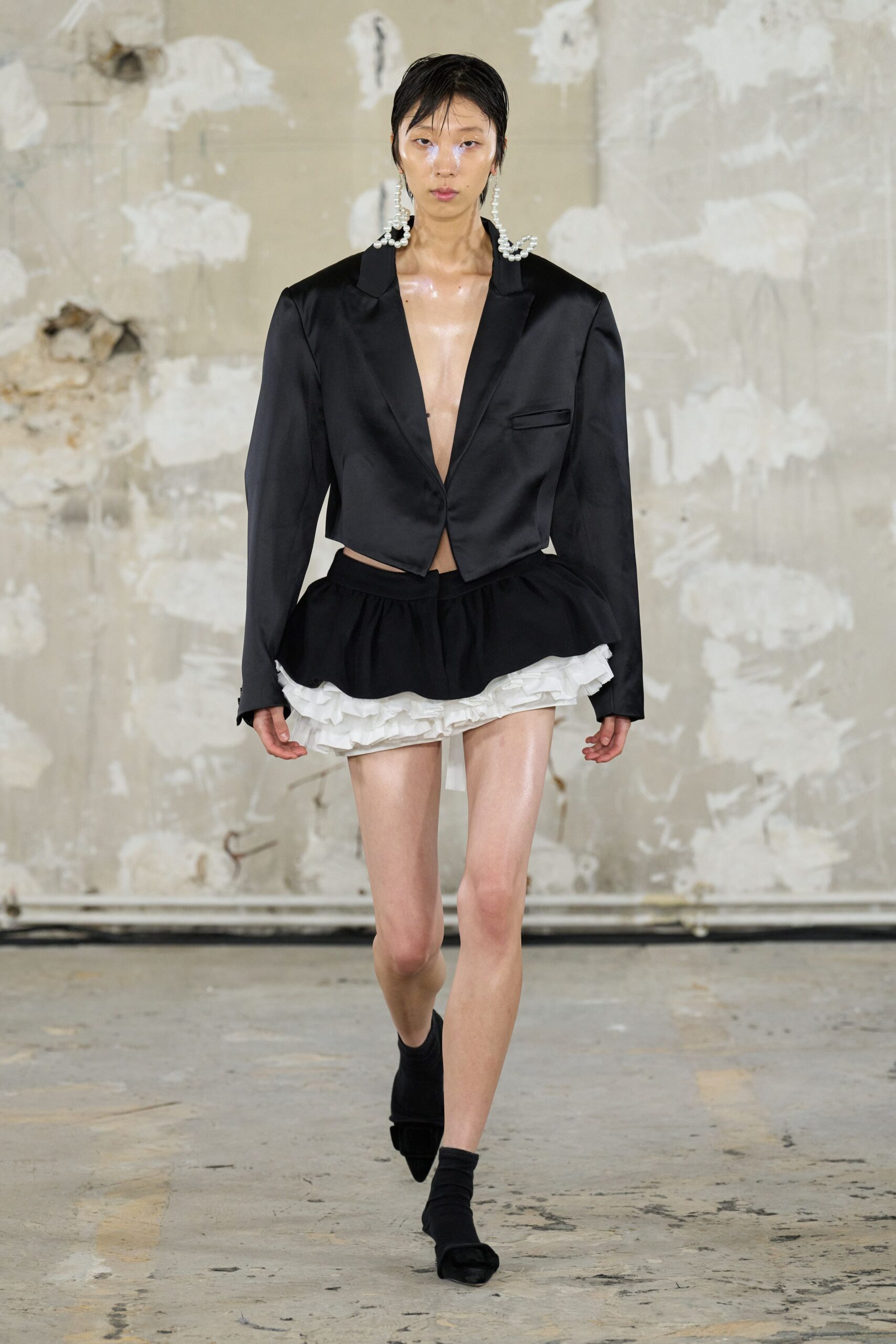black silk fitted jacket with white mini skirt