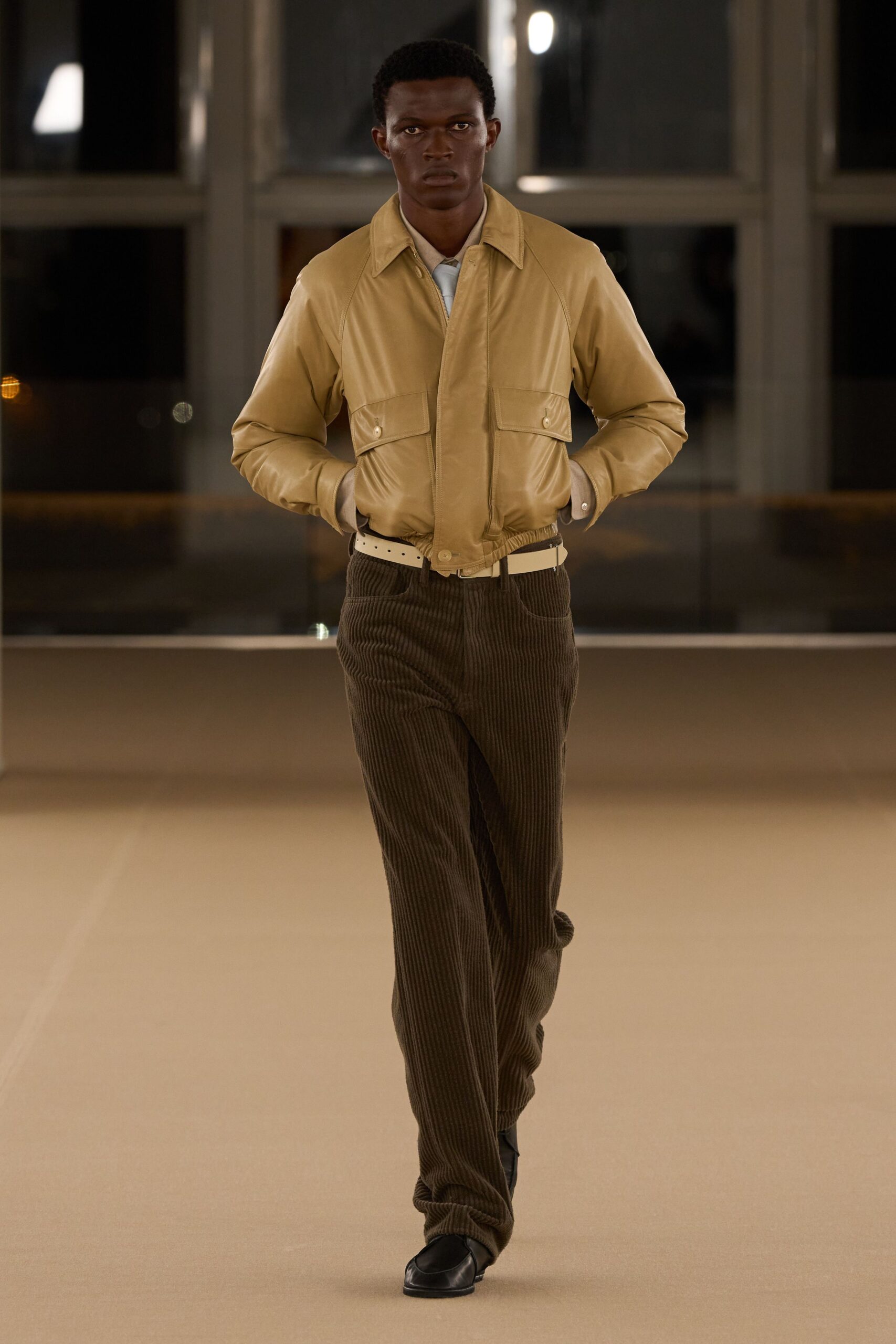 beige jacket brown striped pants
