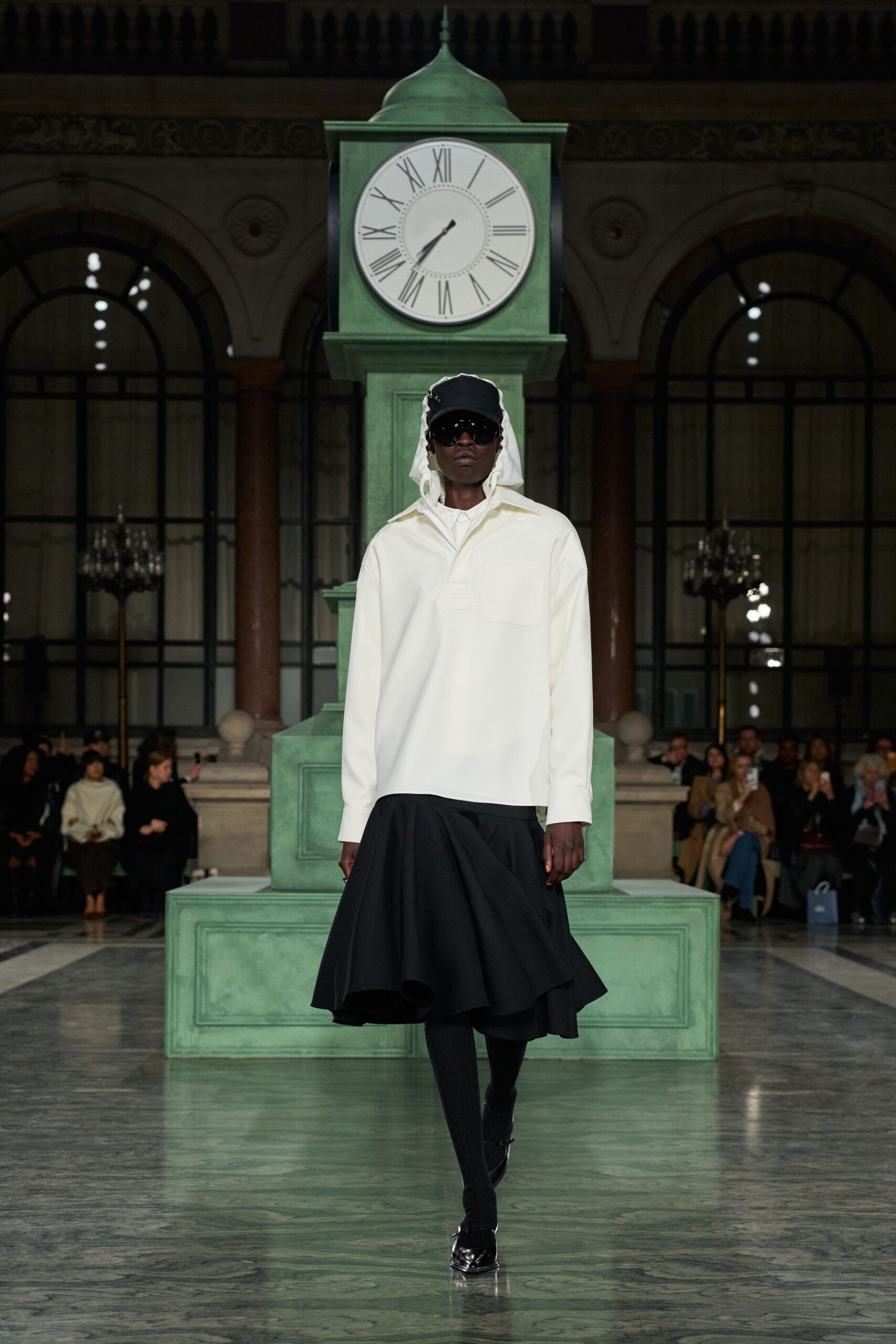 white hoodie black flared skirt
