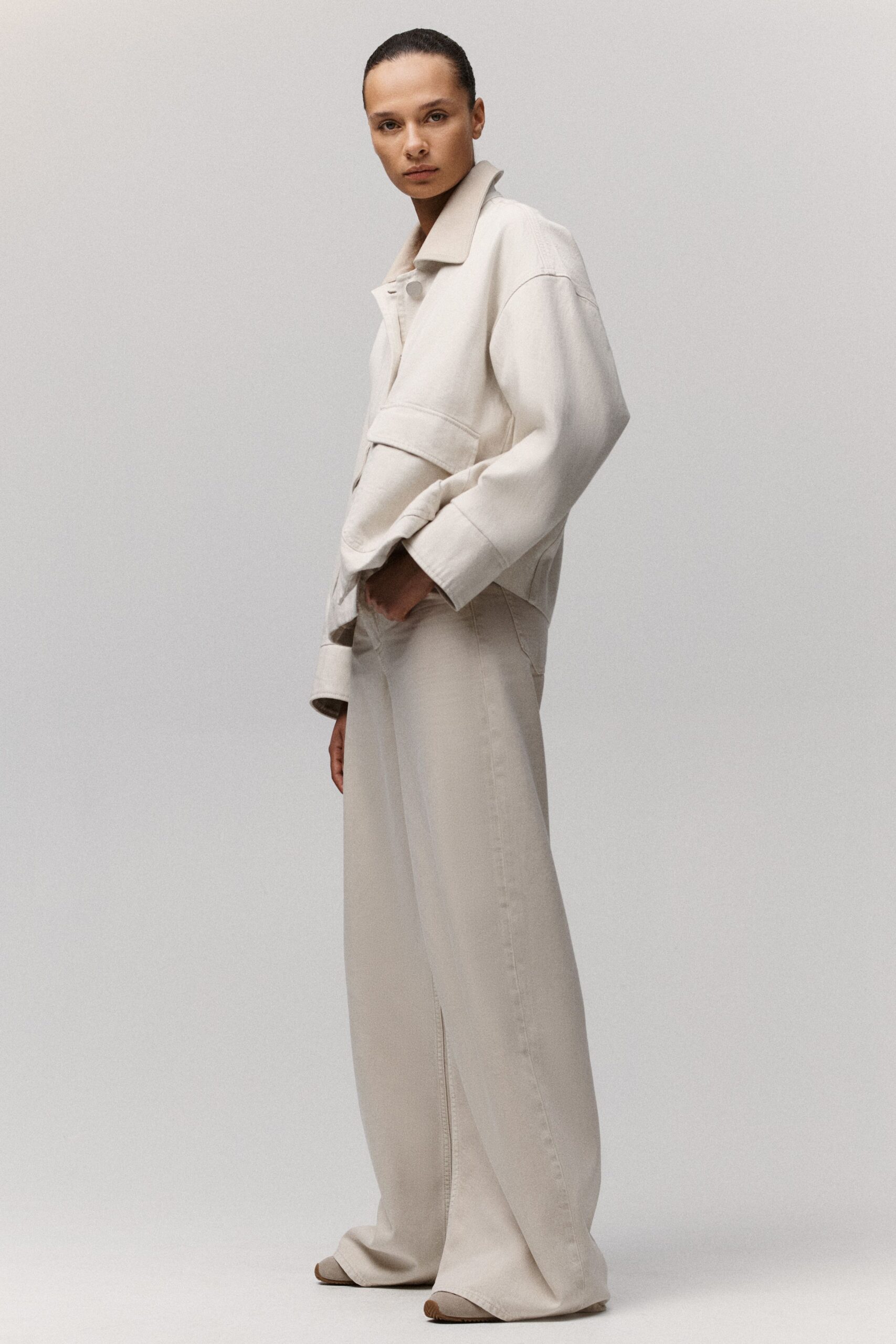 white relaxed jacket beige pants