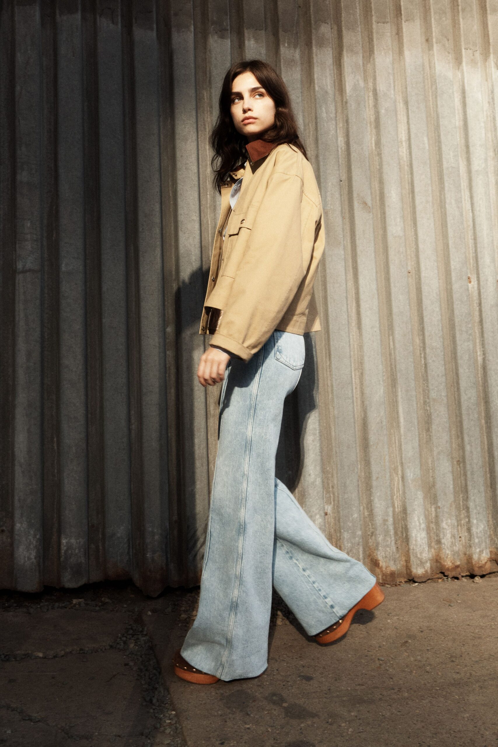 beige jacket blue flared pants