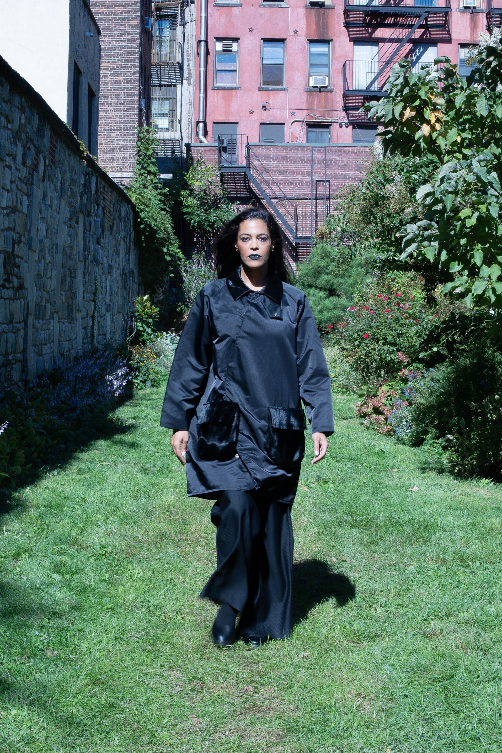black coat with black pants and boots