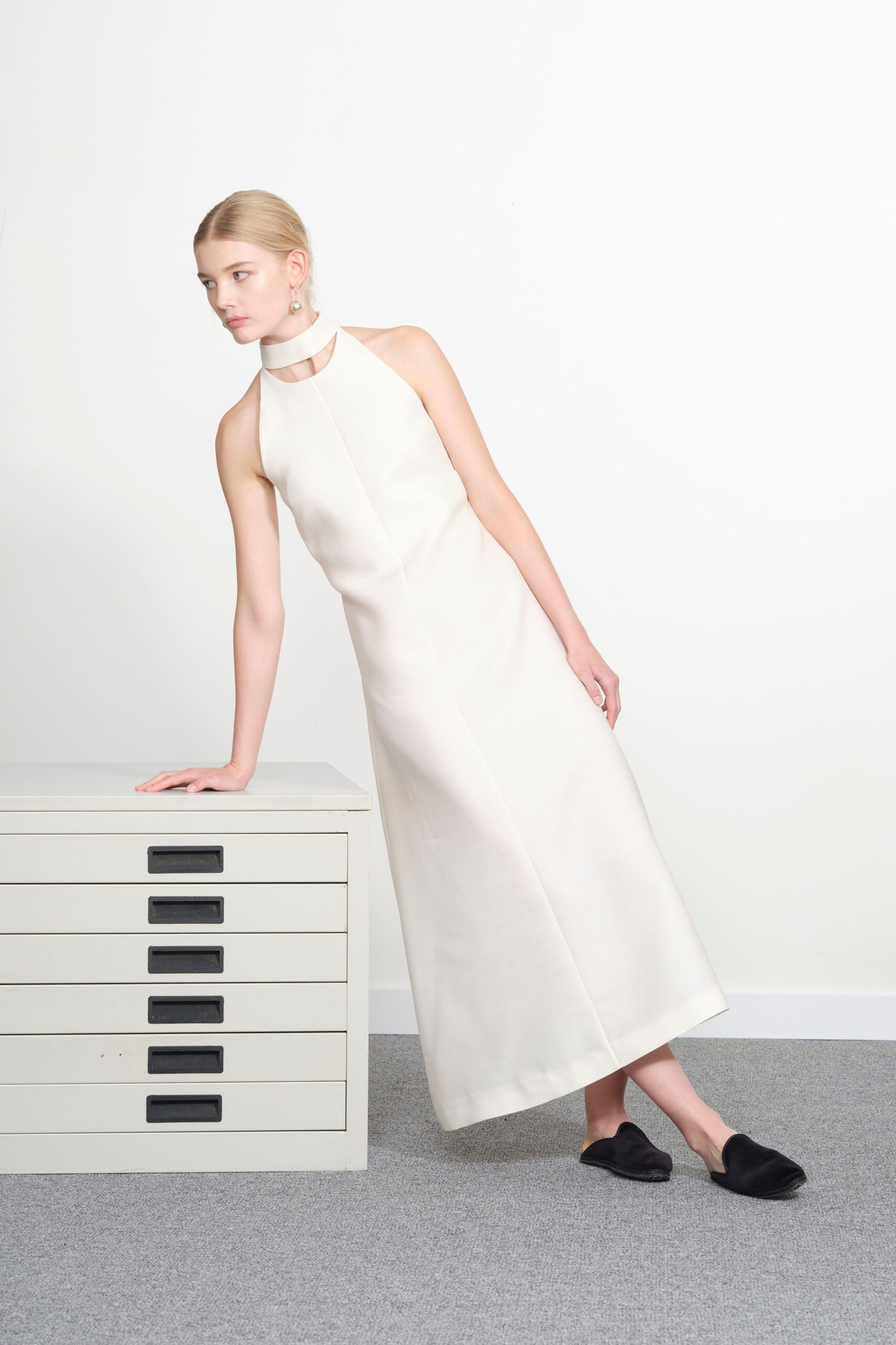 white cotton sleeveless high-neck fitted straight-leg maxi gown
