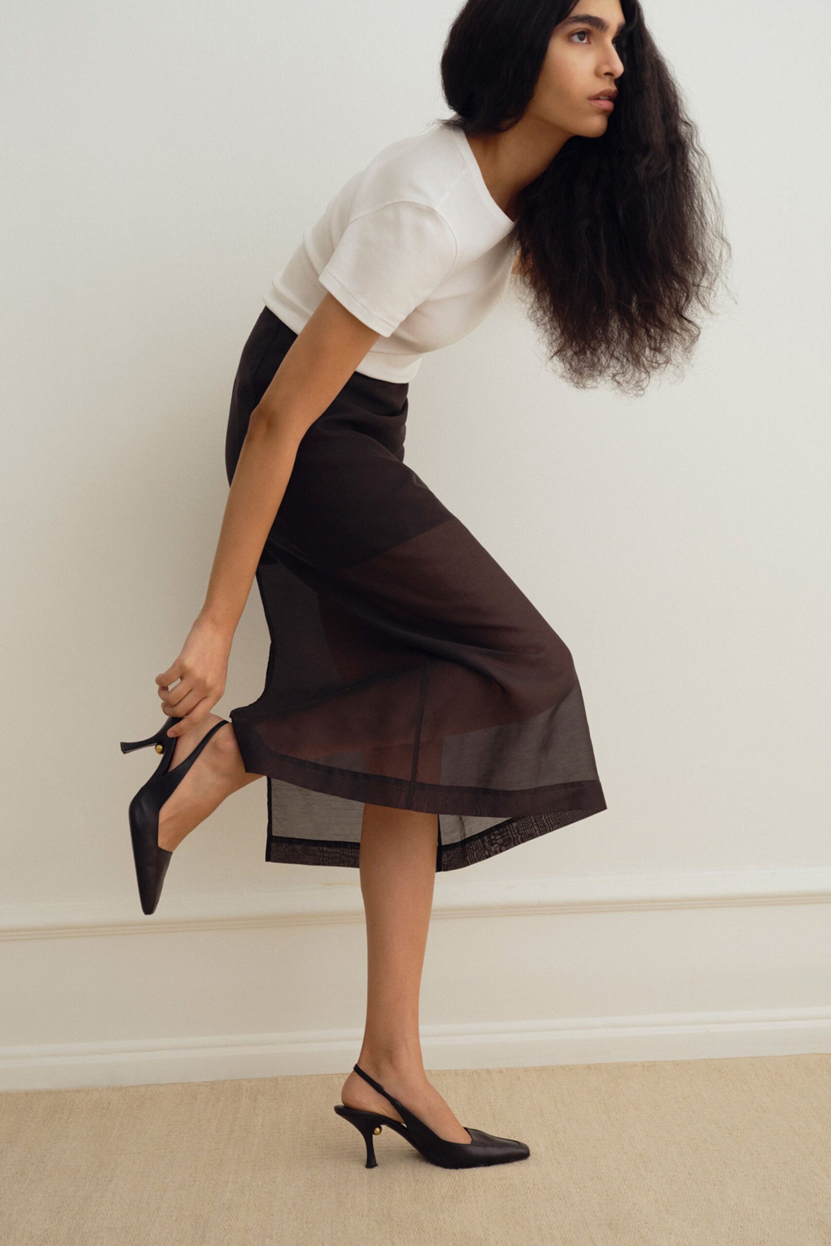 white fitted top black midi skirt