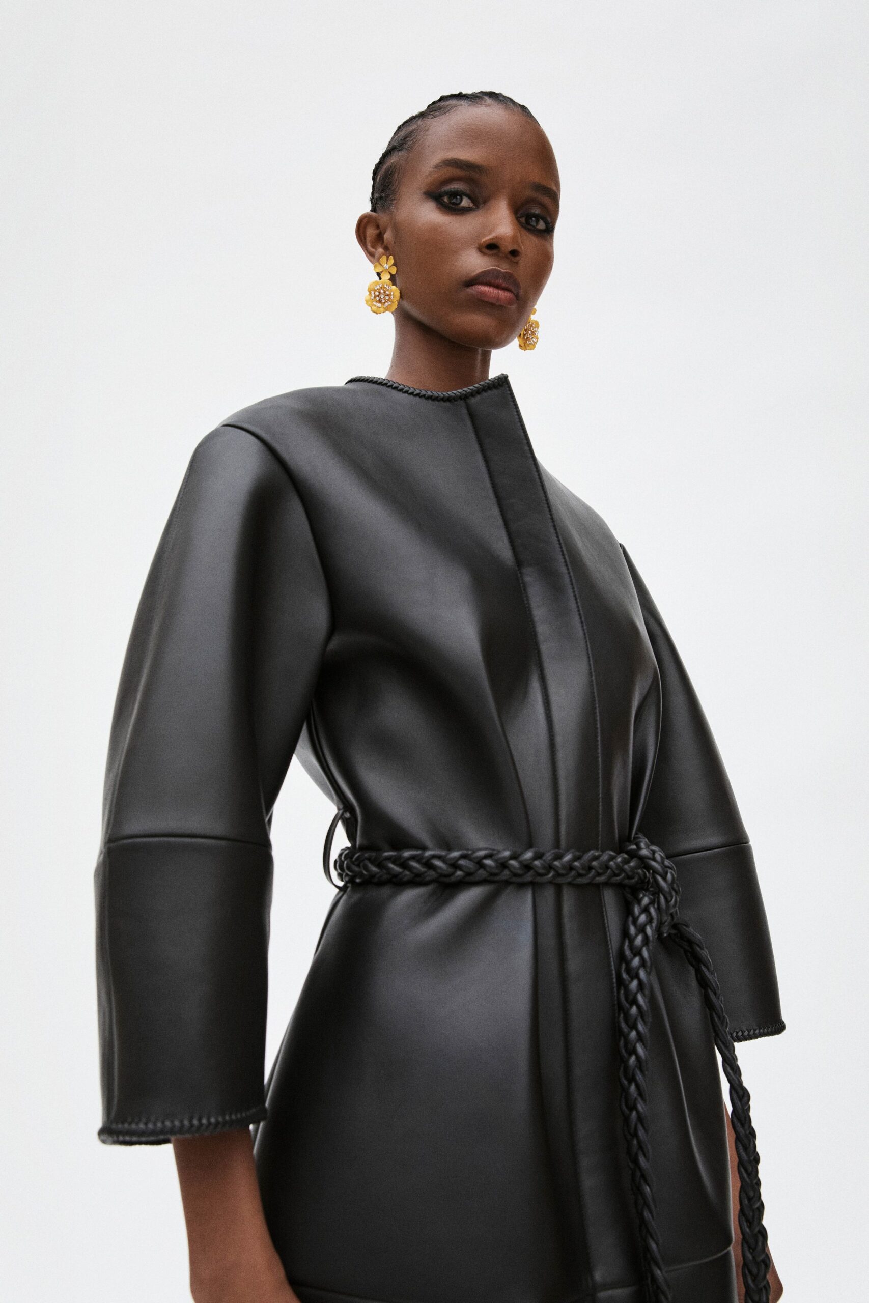 fitted black leather coat