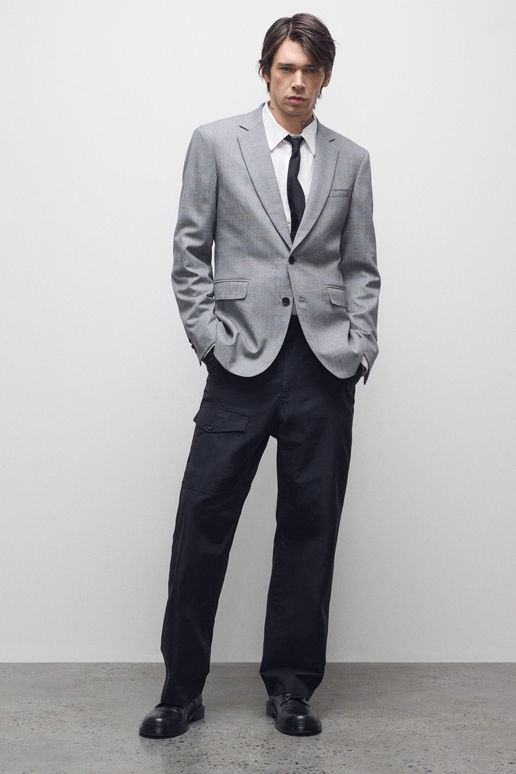 gray tailored blazer with black pants