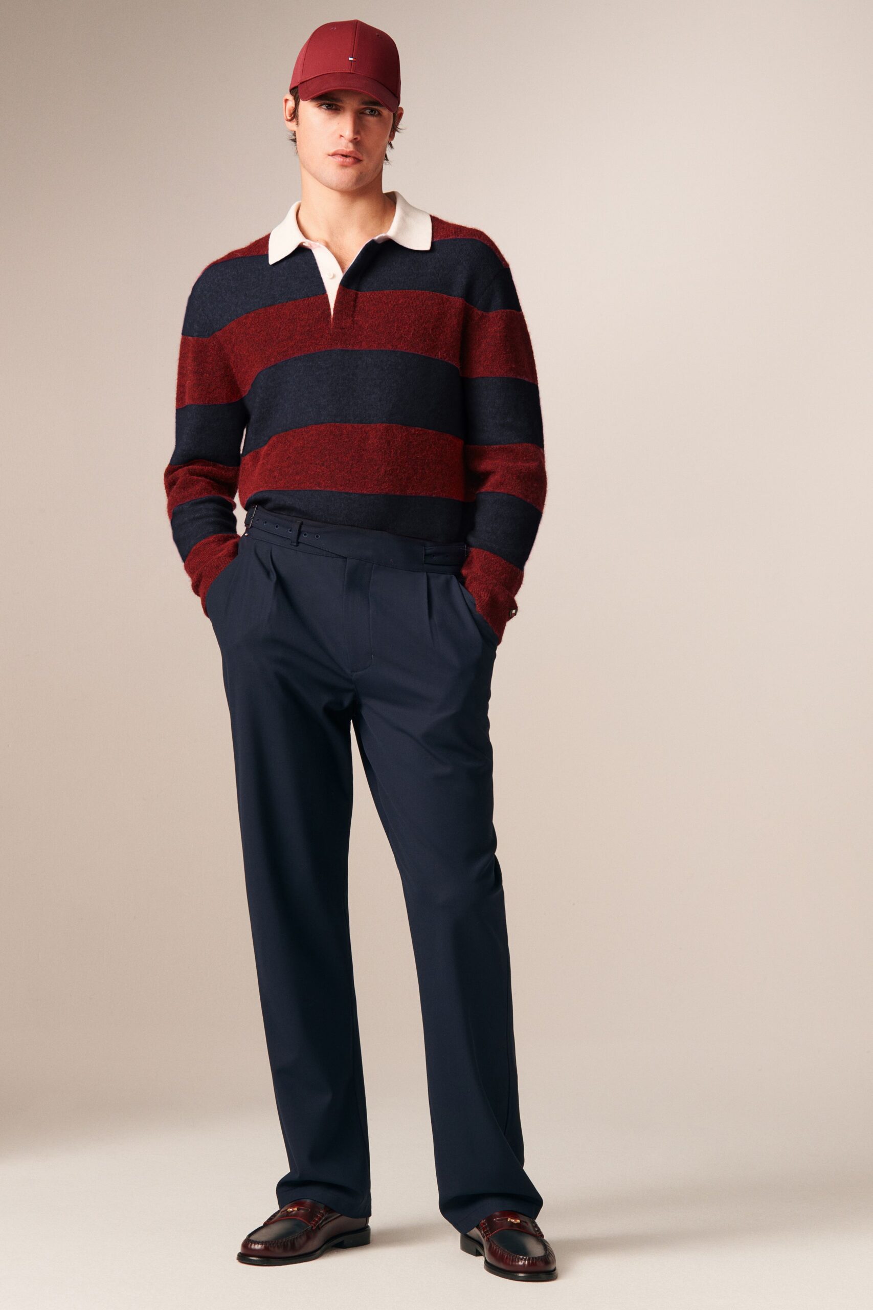 red and blue striped sweater with tailored pants