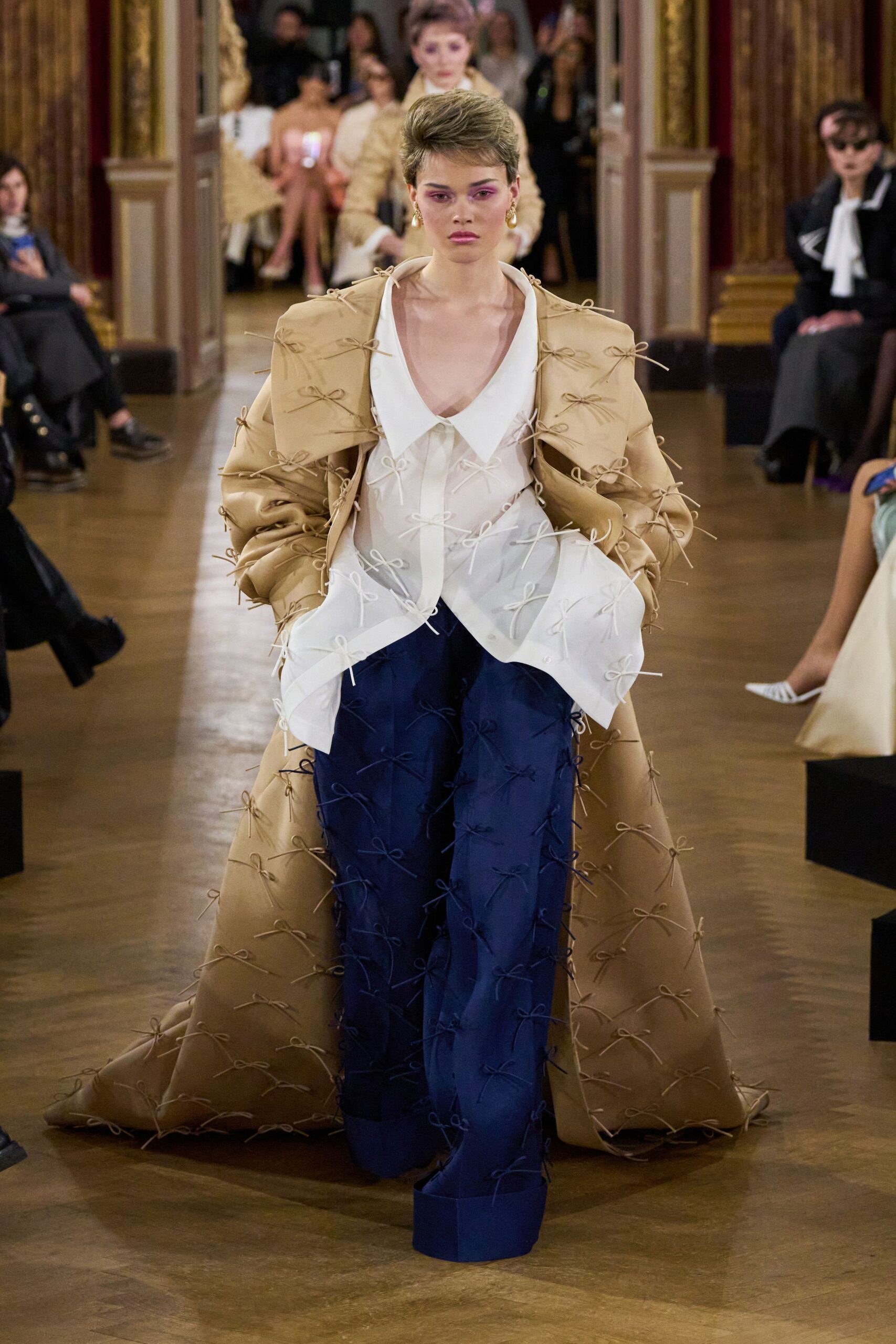 beige embroidered coat with white shirt