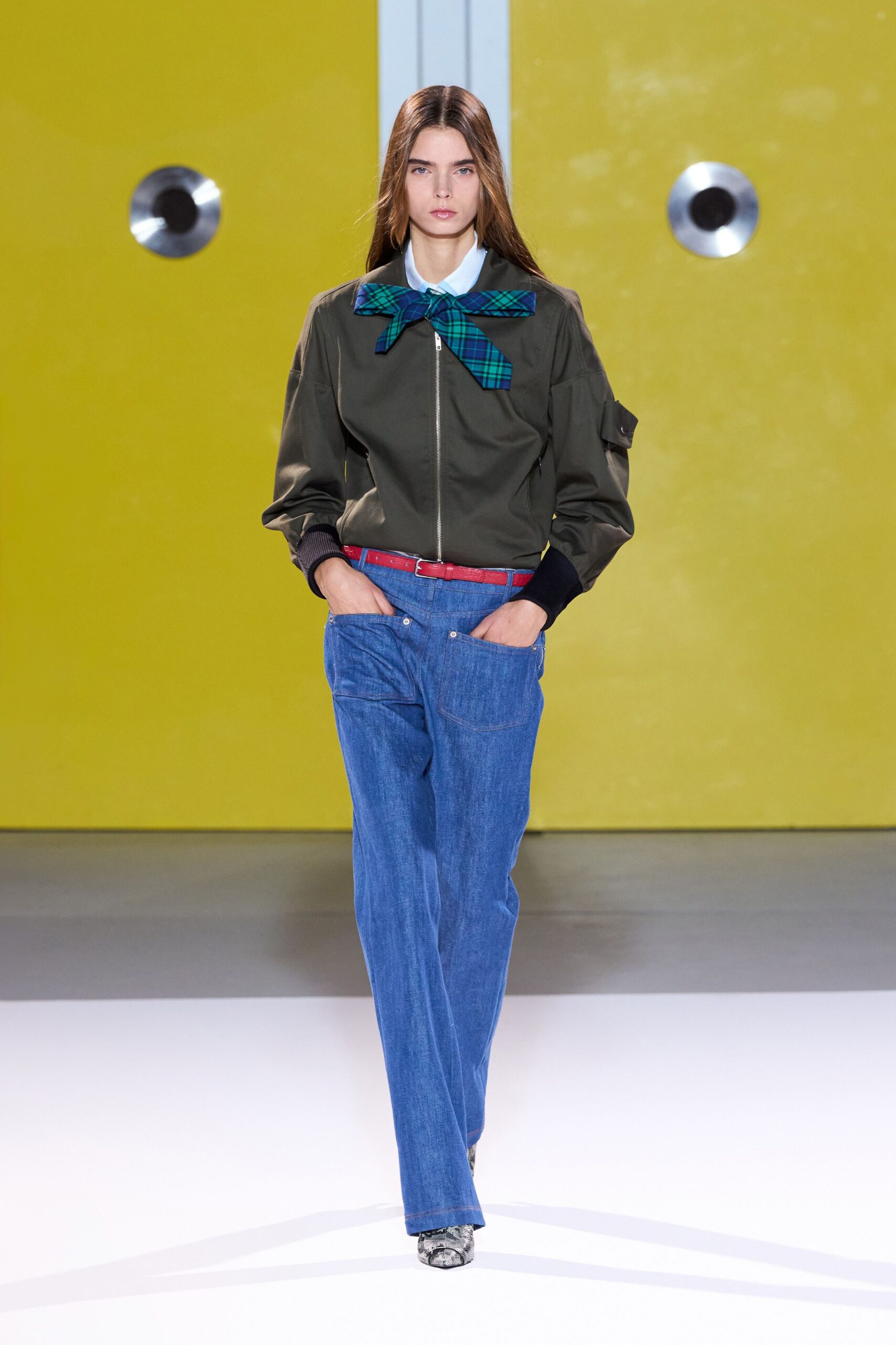 green relaxed jacket with blue denim pants