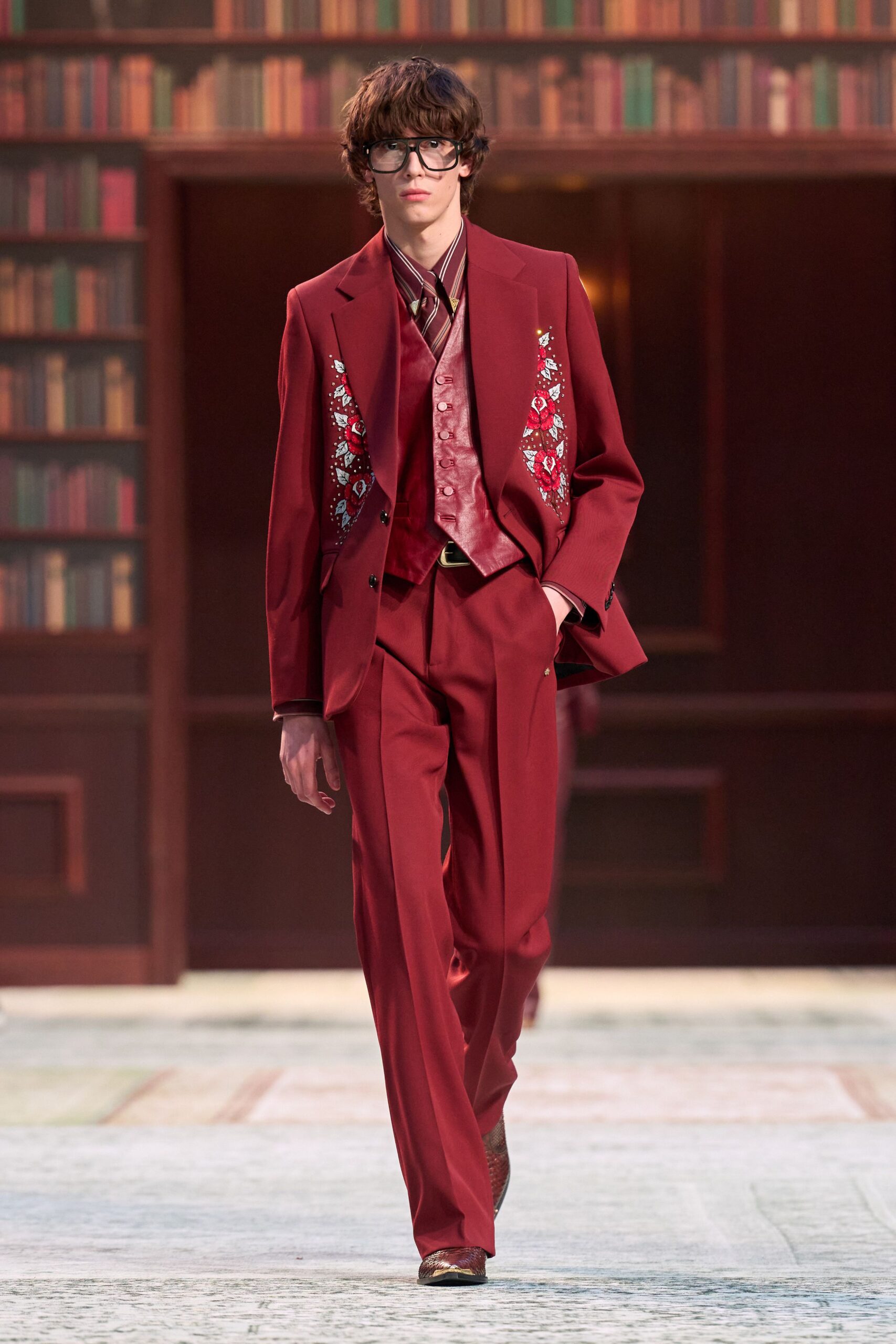 red tailored suit with embroidered details