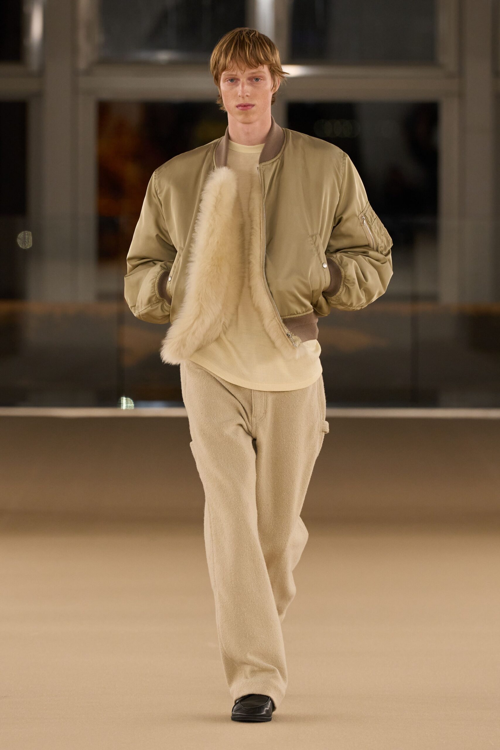 beige leather jacket with beige top and pants