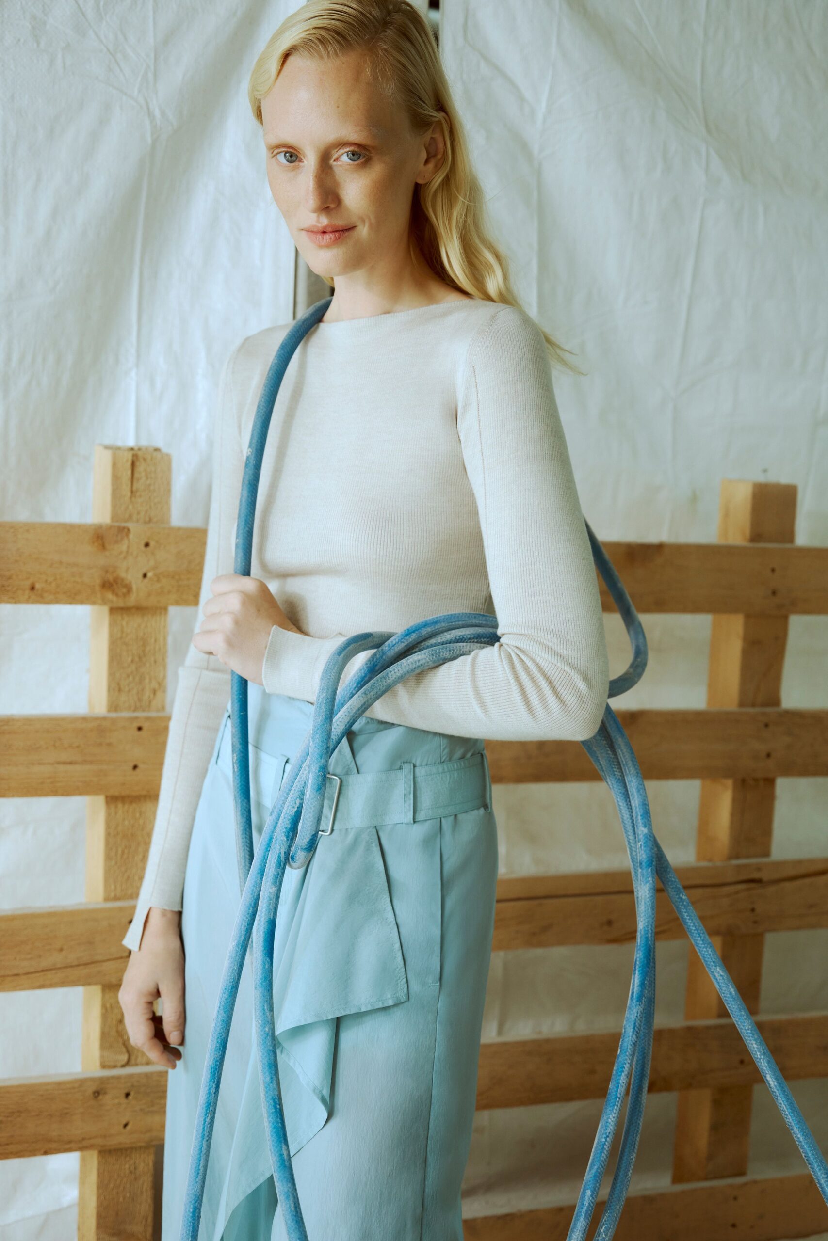 beige fitted top and blue tailored skirt