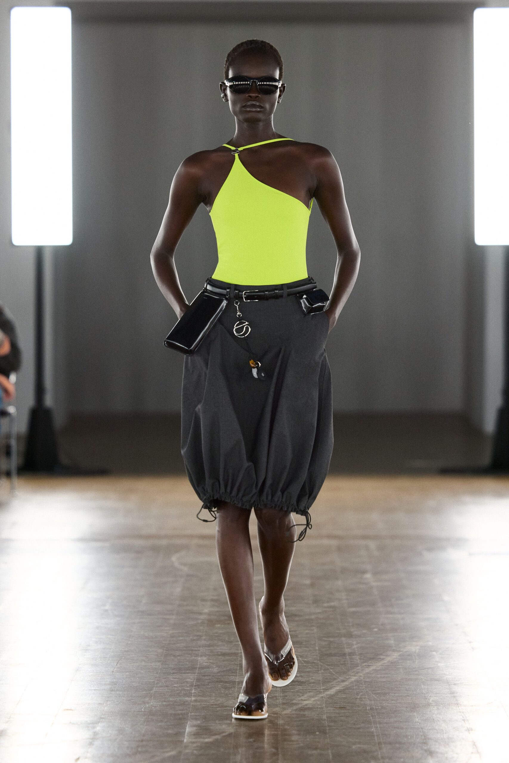 neon yellow halter top with gray skirt