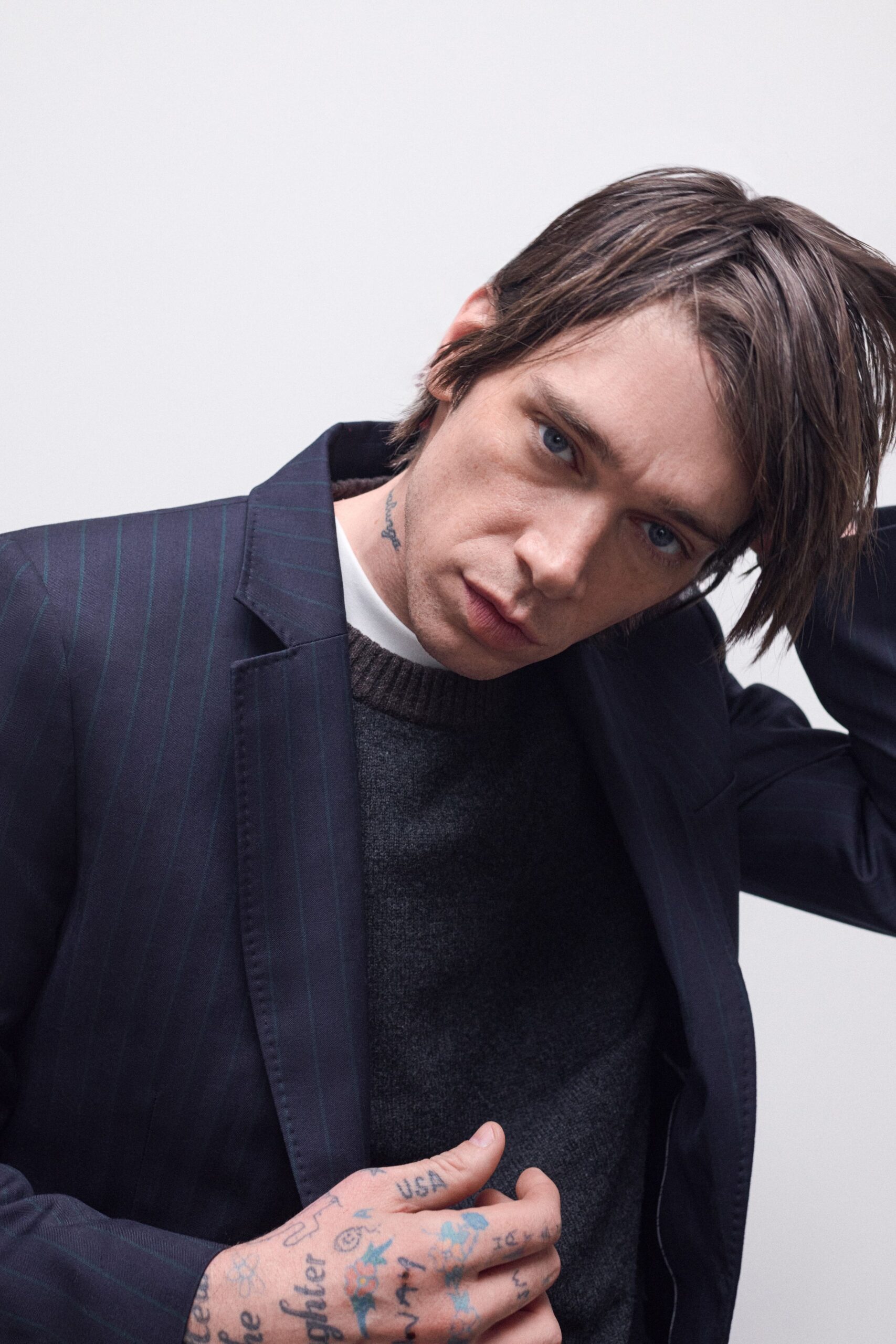tailored blazer with sweater and t-shirt