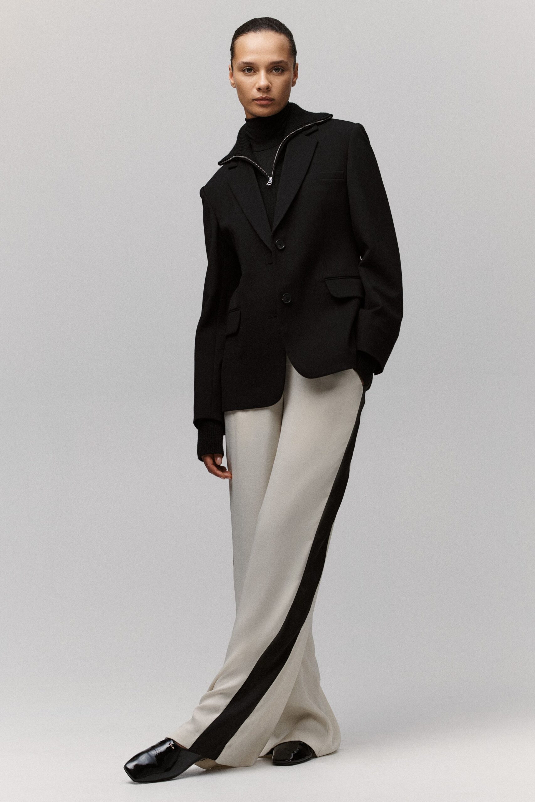 black blazer beige pants