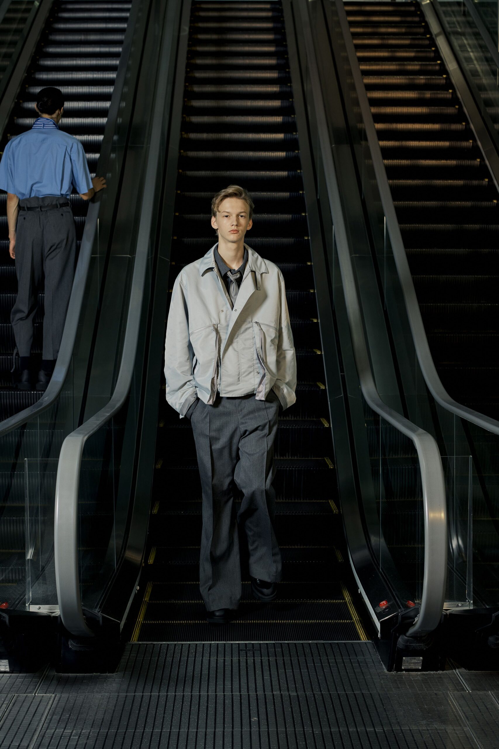 white relaxed jacket with gray pants