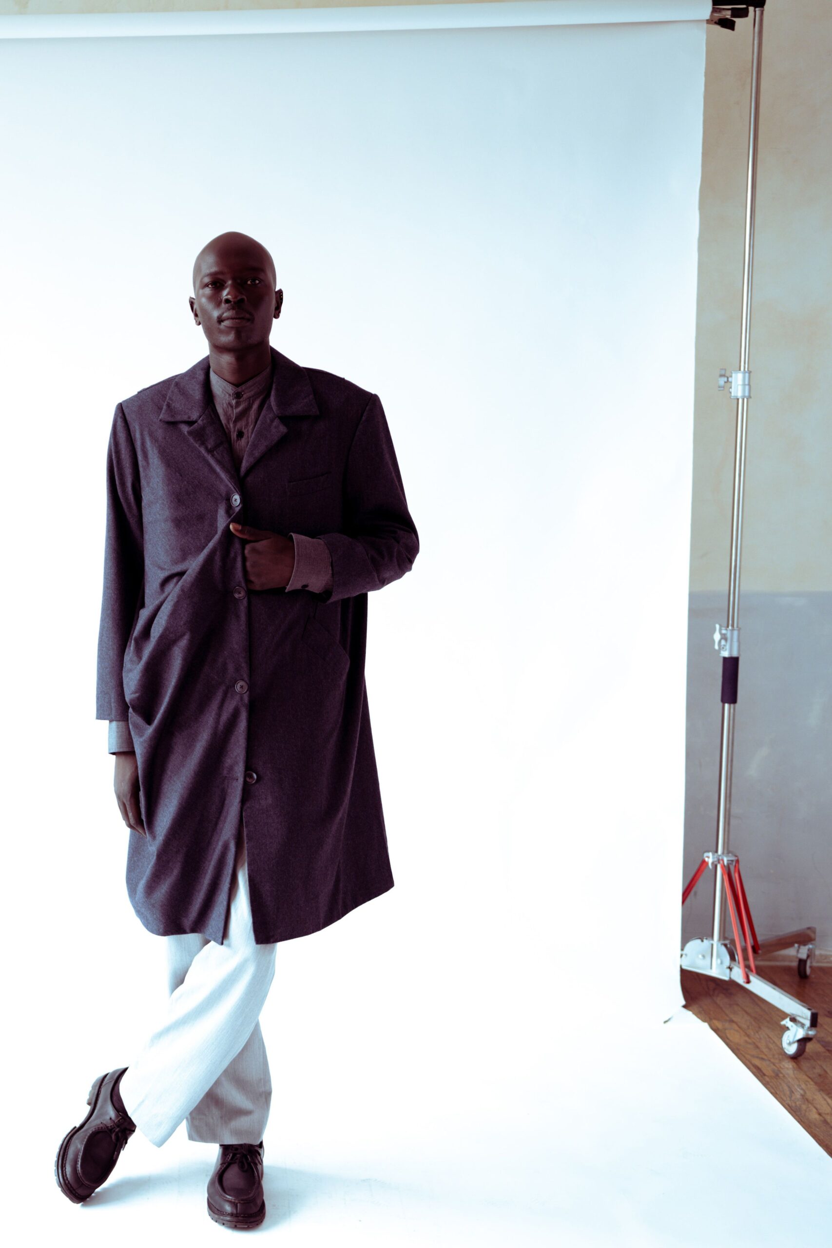 gray wool coat with white pants