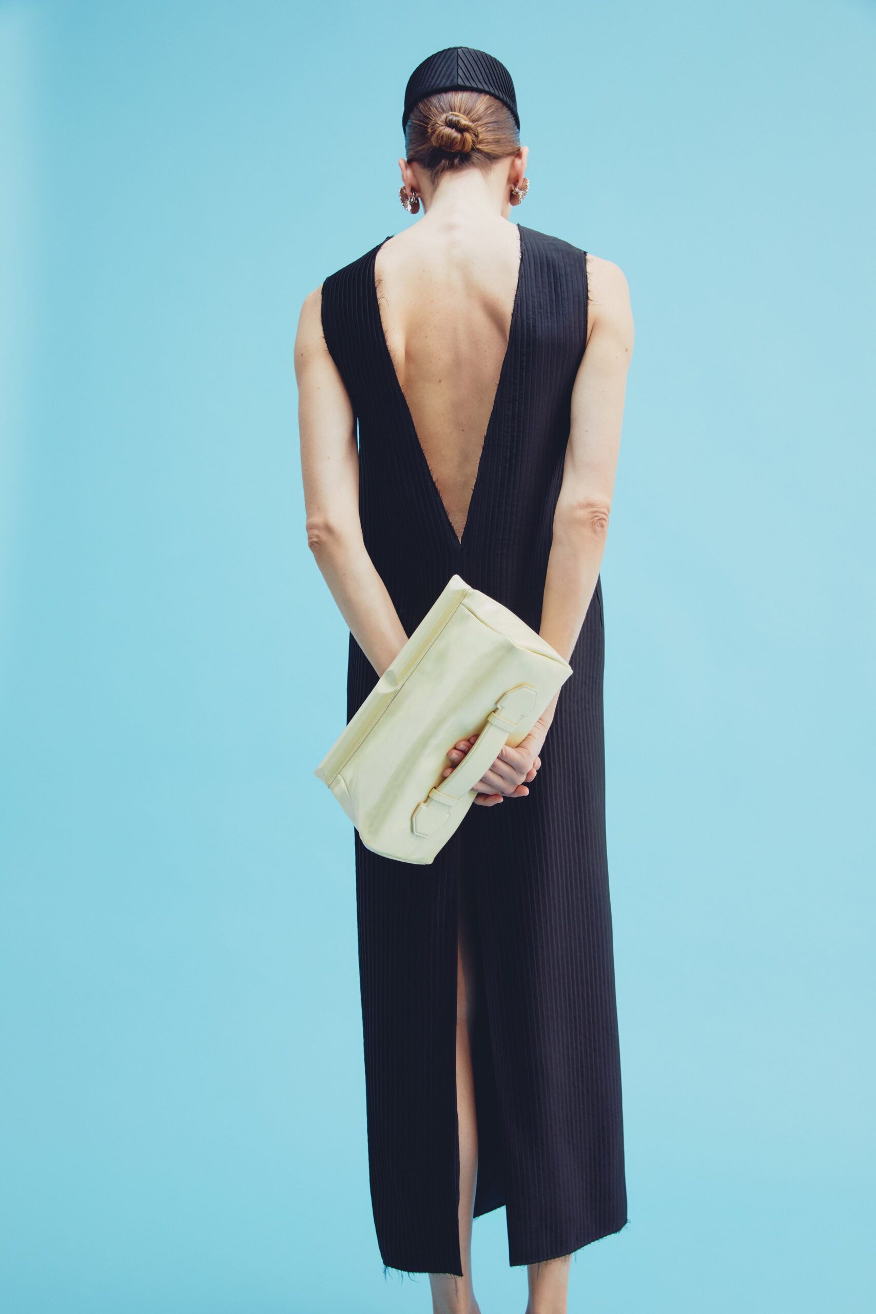 black fitted gown with clutch
