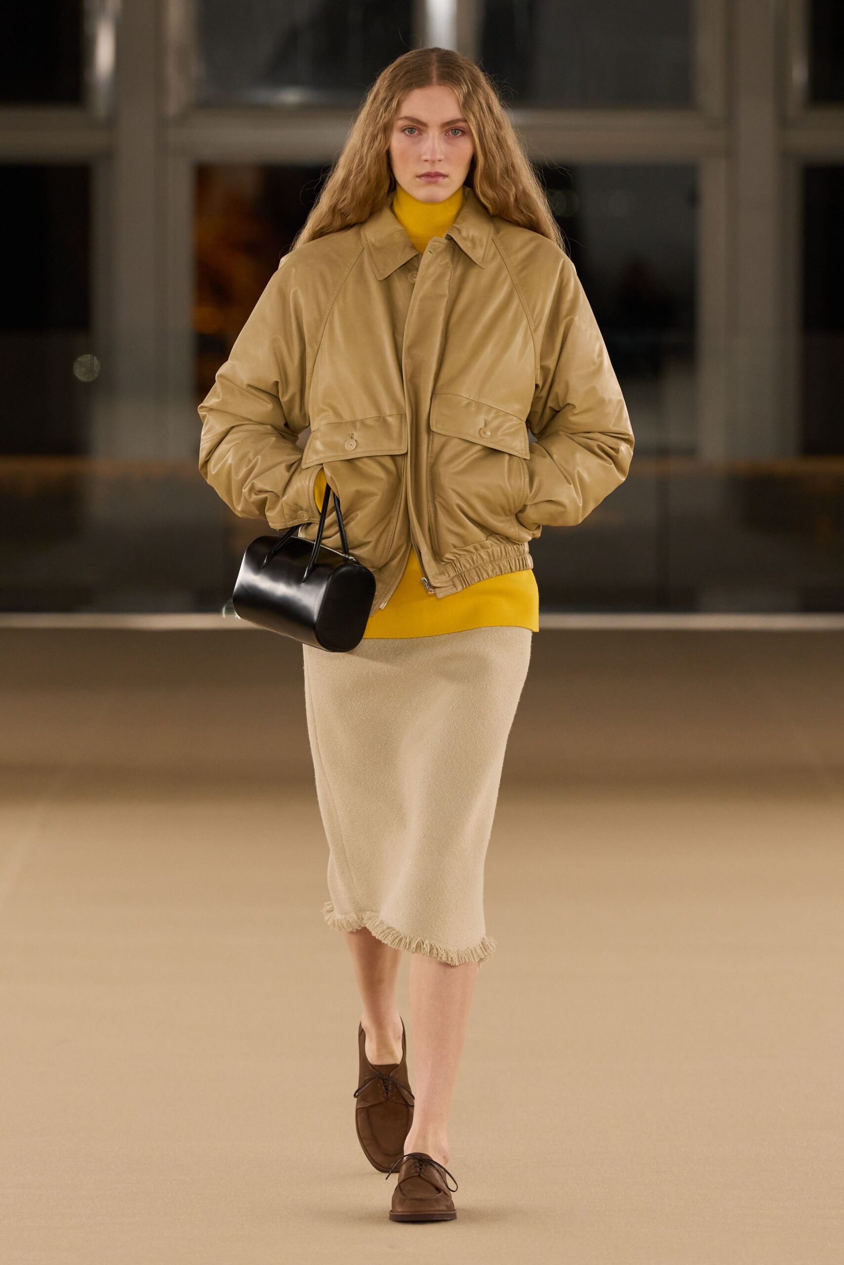 beige leather jacket with yellow top