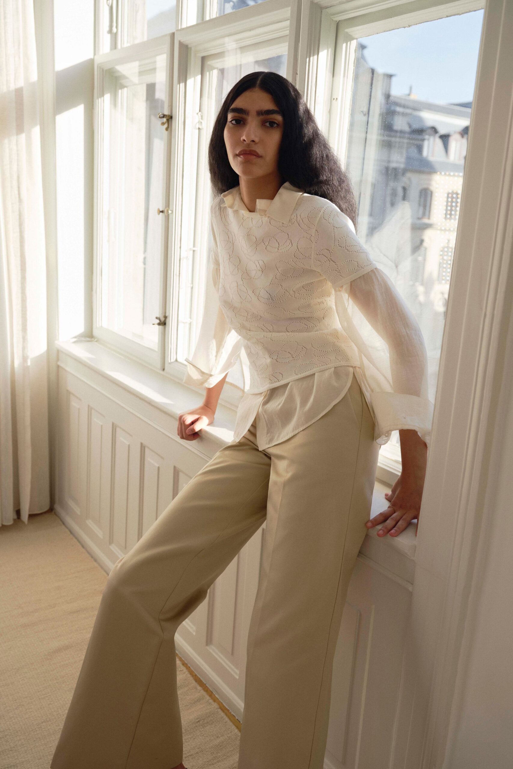 white embroidered blouse beige pants