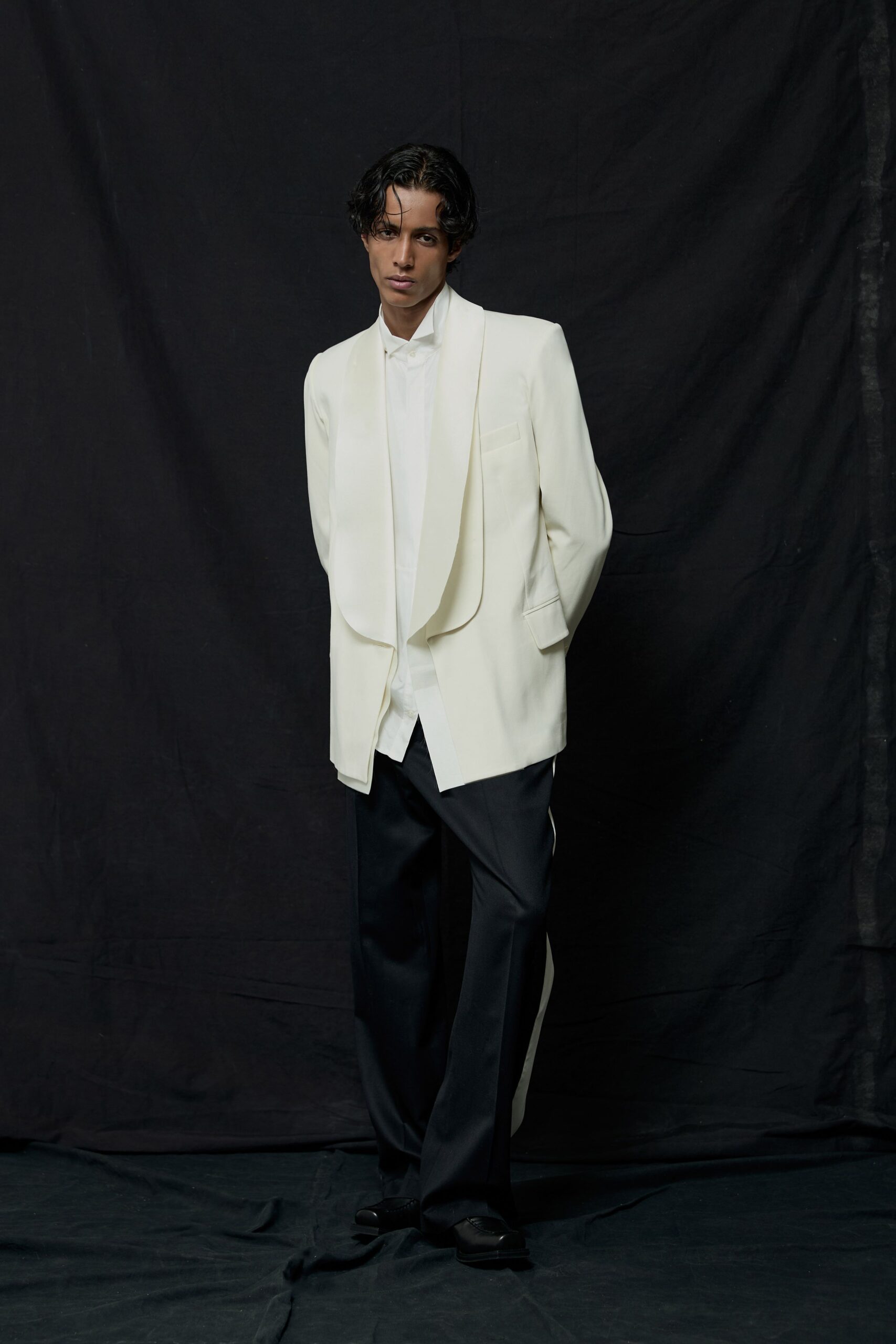 white tailored blazer with black pants