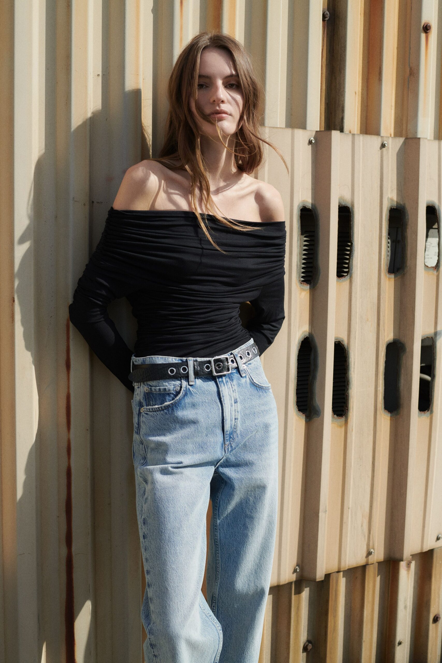 black off-shoulder top with jeans