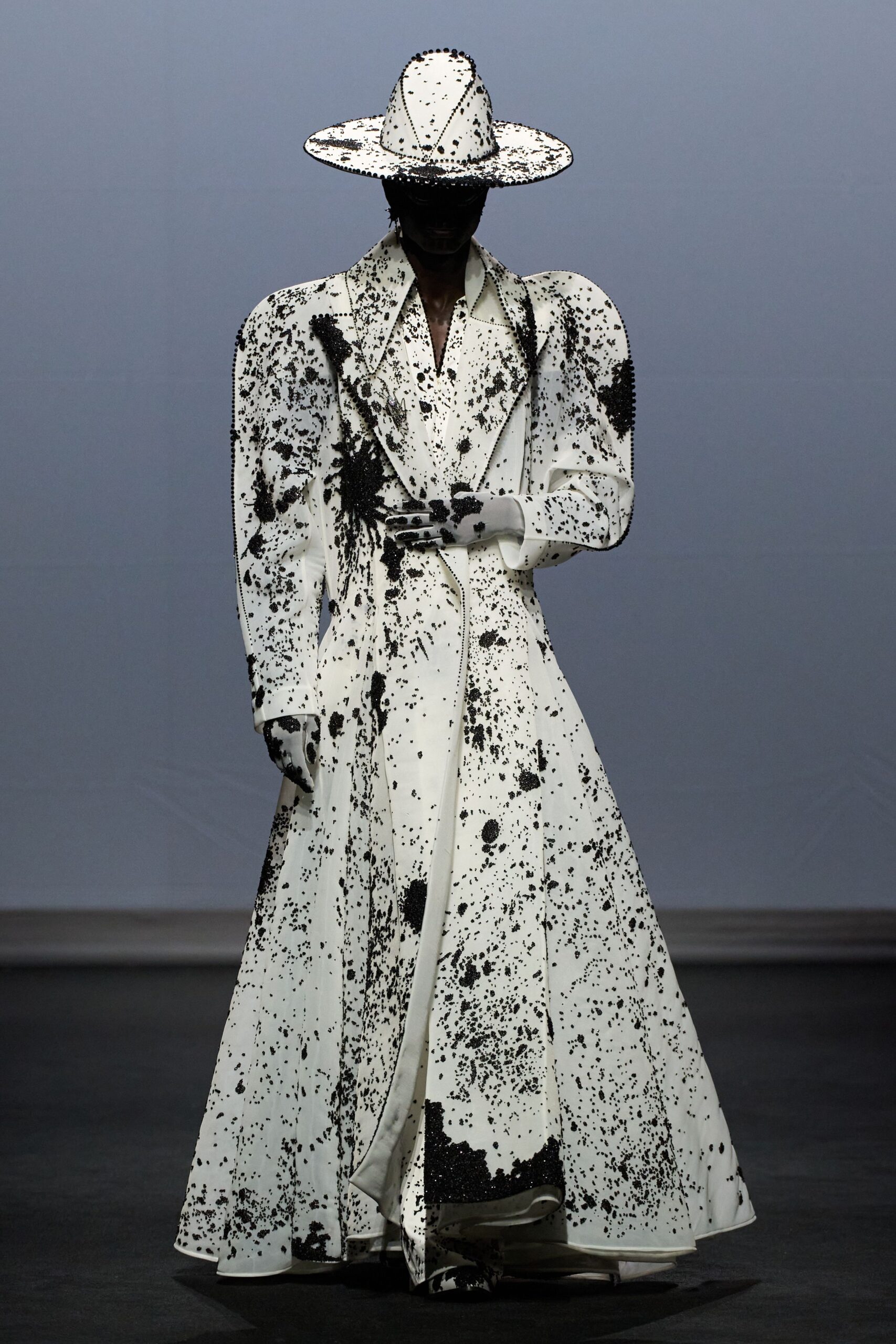 white and black printed coat with hat