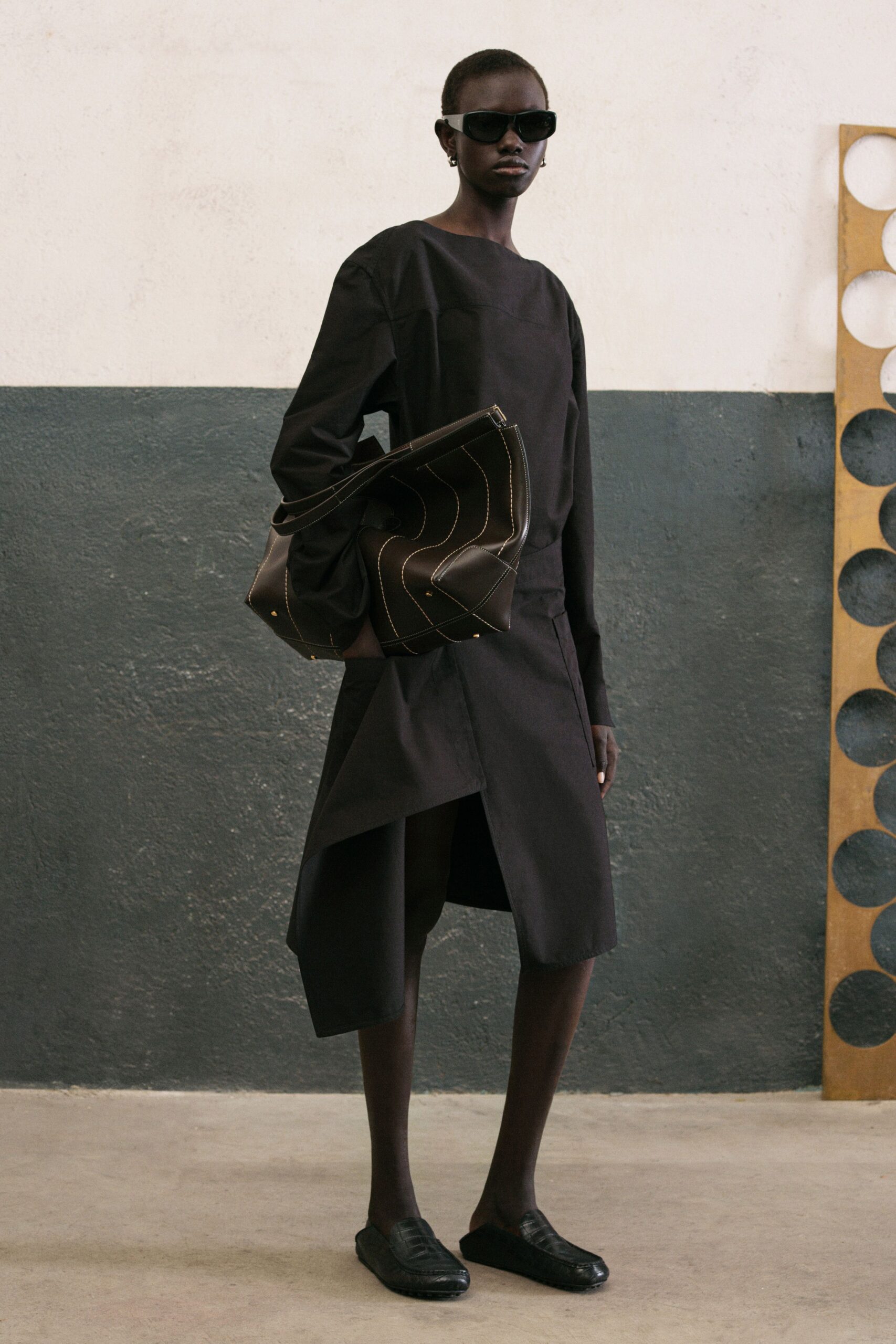black relaxed top with asymmetric skirt