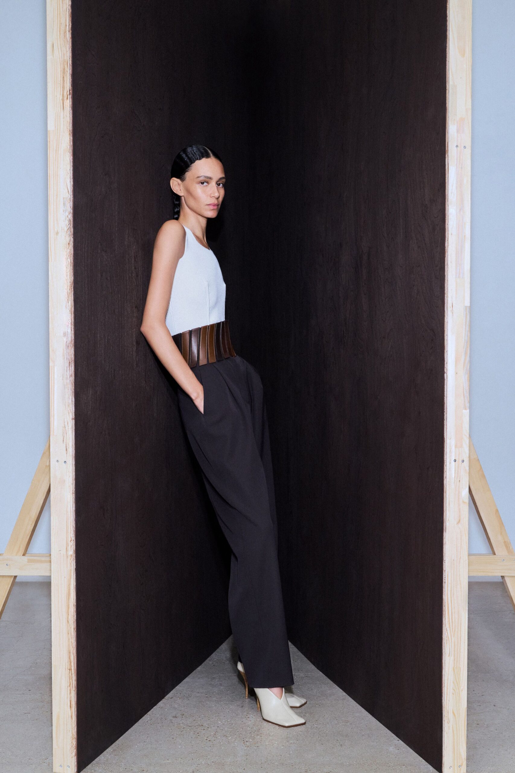 white fitted top black relaxed pants