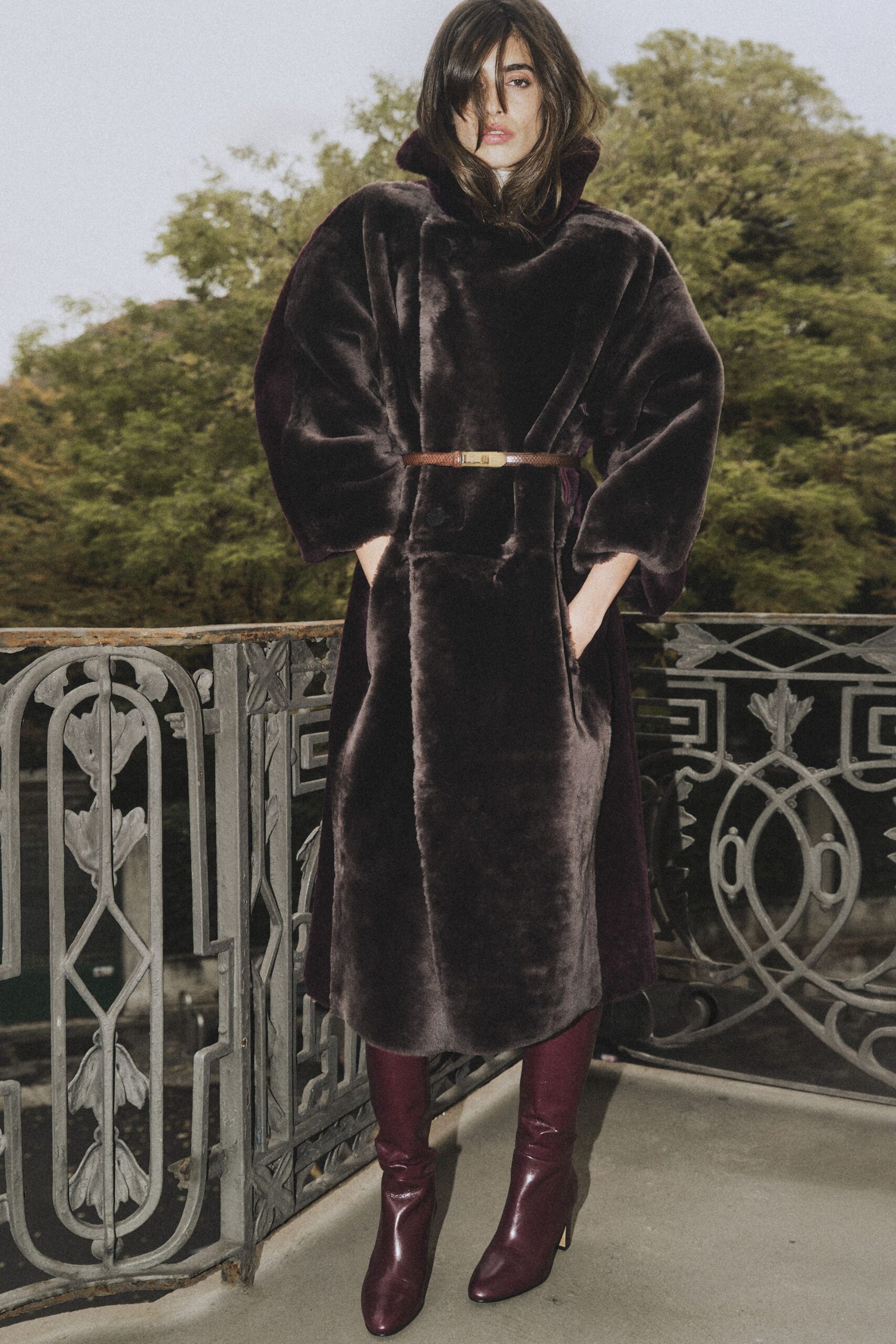 purple faux-fur coat with burgundy shoes