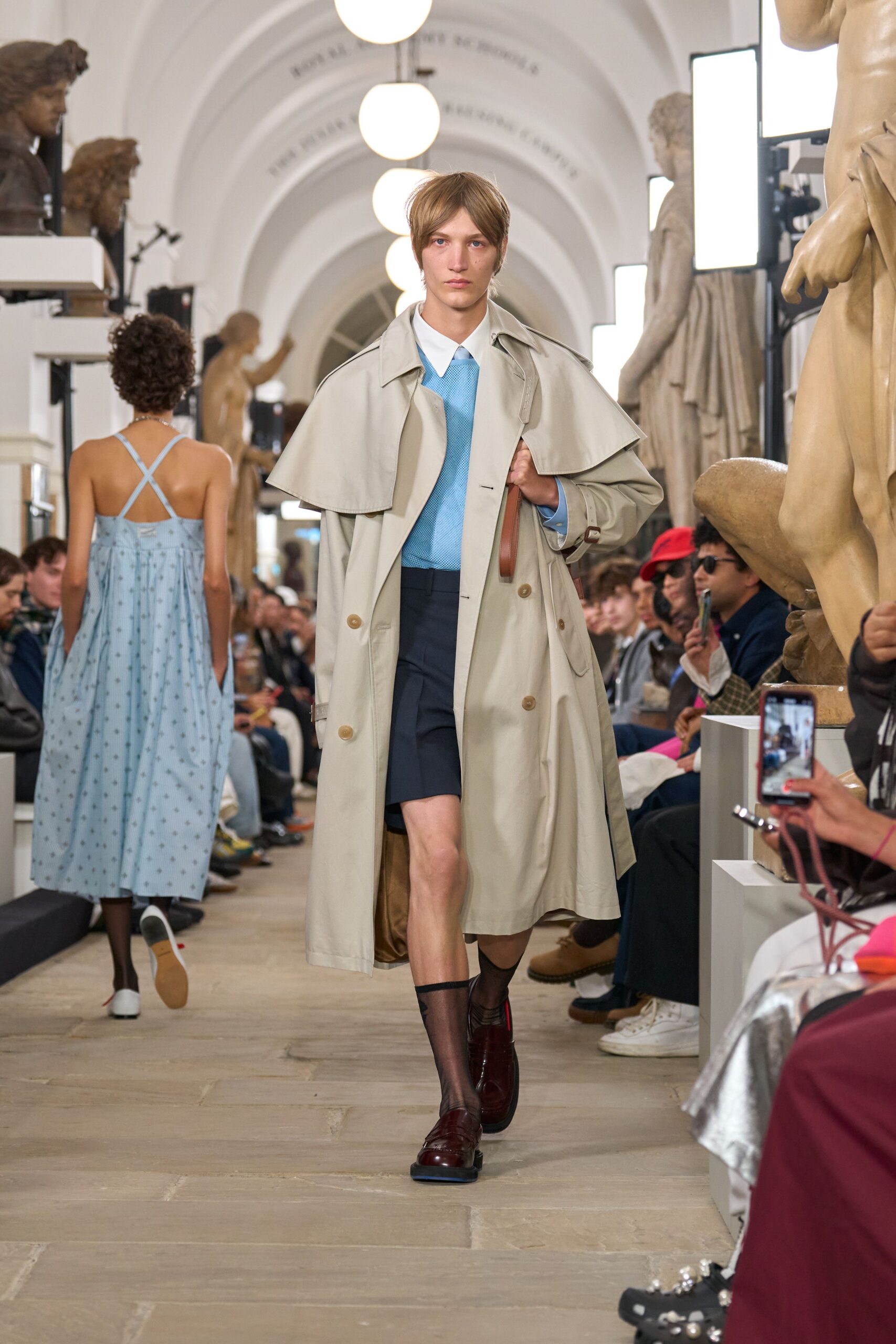 beige trench coat with blue shirt