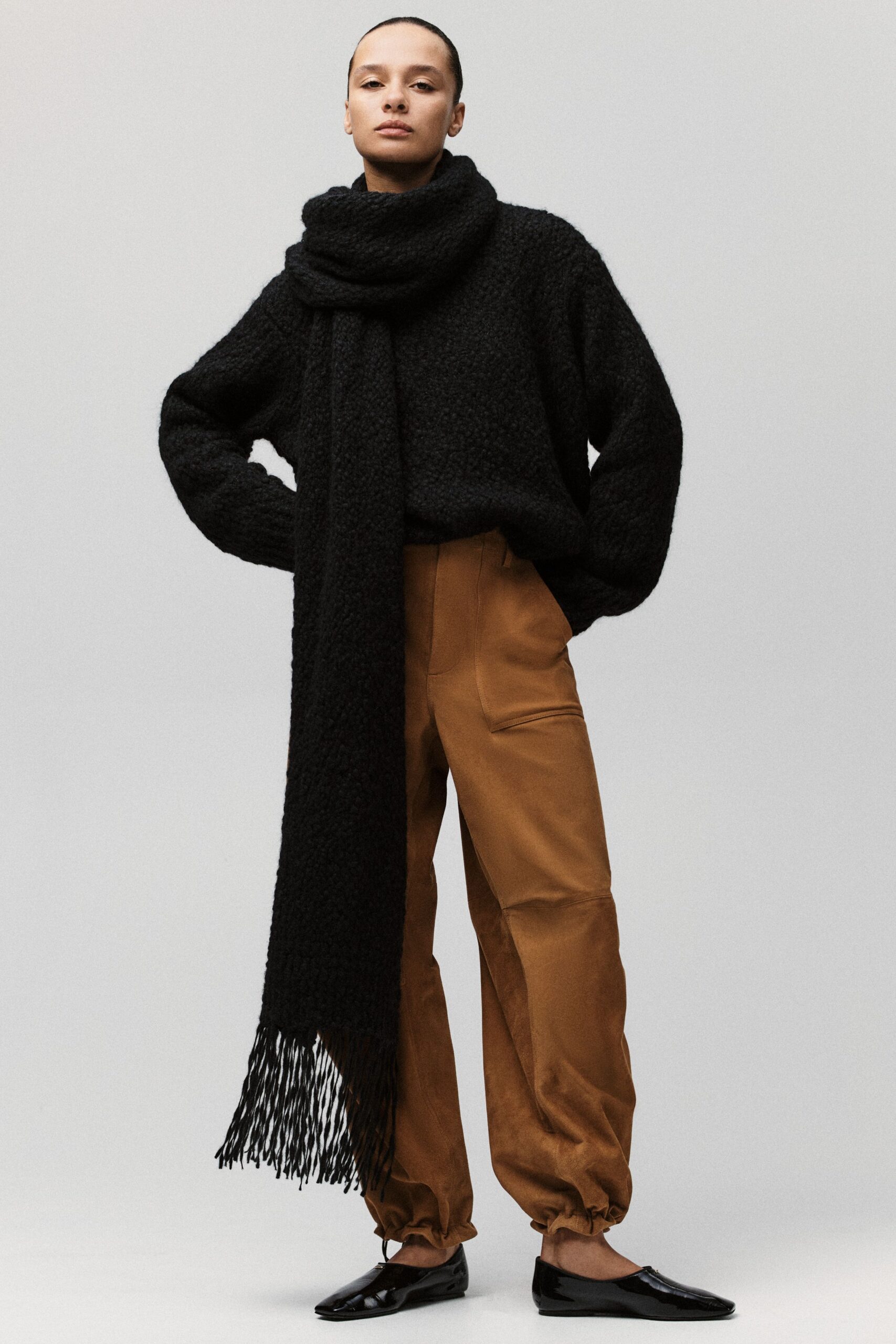 black oversized sweater with brown pants