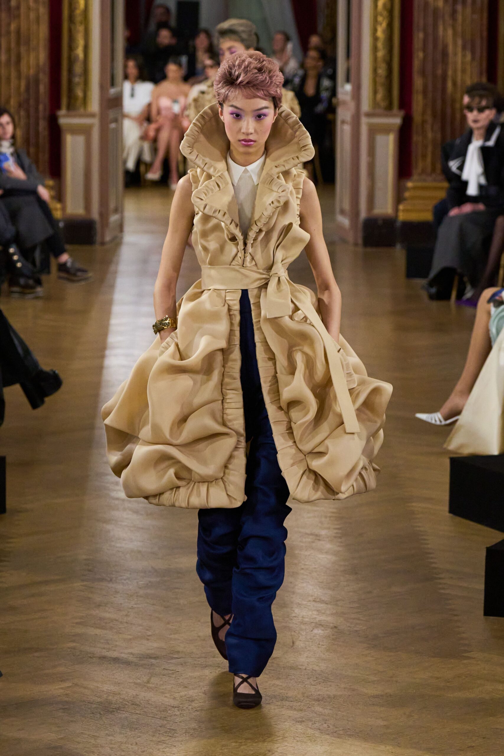beige ruffled midi dress with blue pants