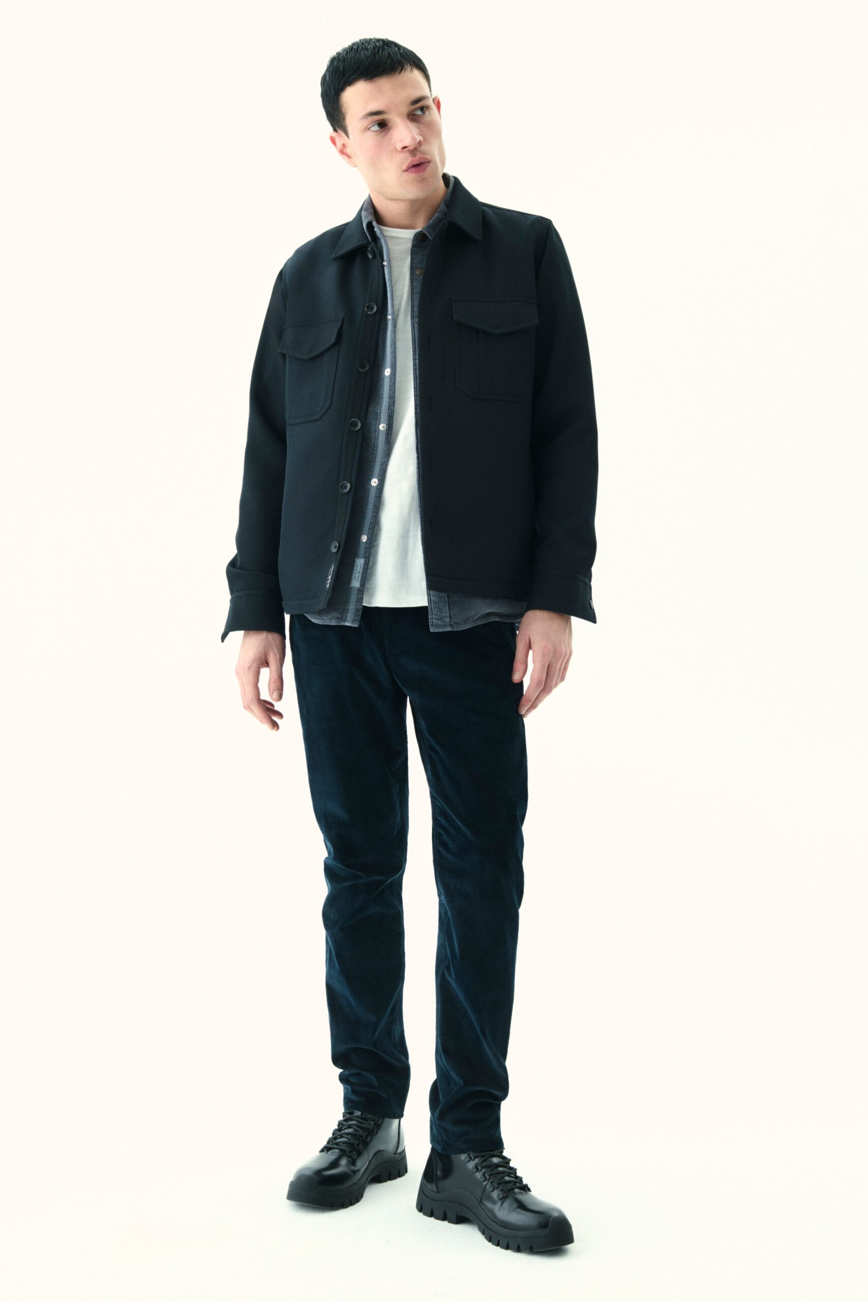 black jacket white shirt blue pants