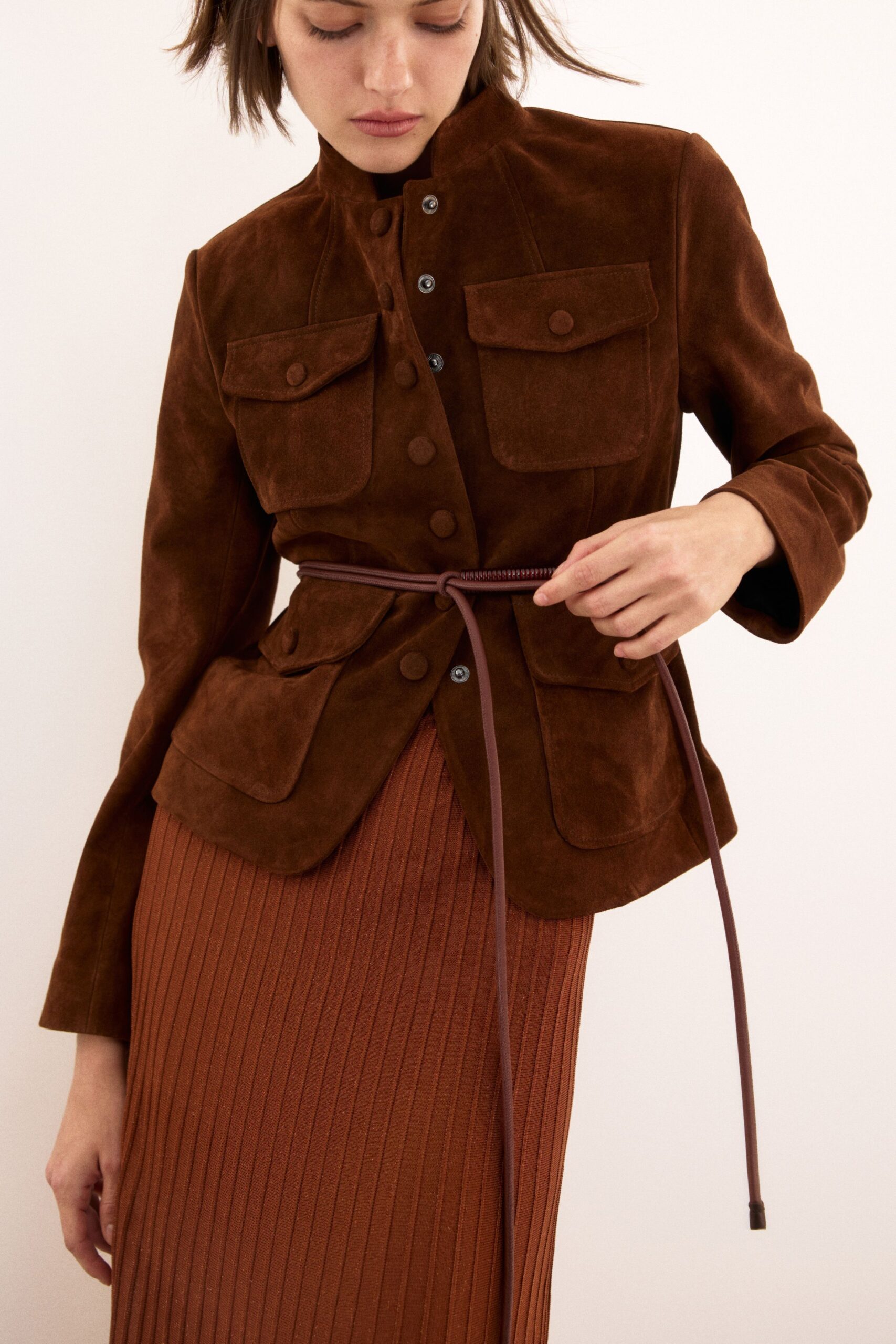 brown suede fitted jacket and pleated skirt