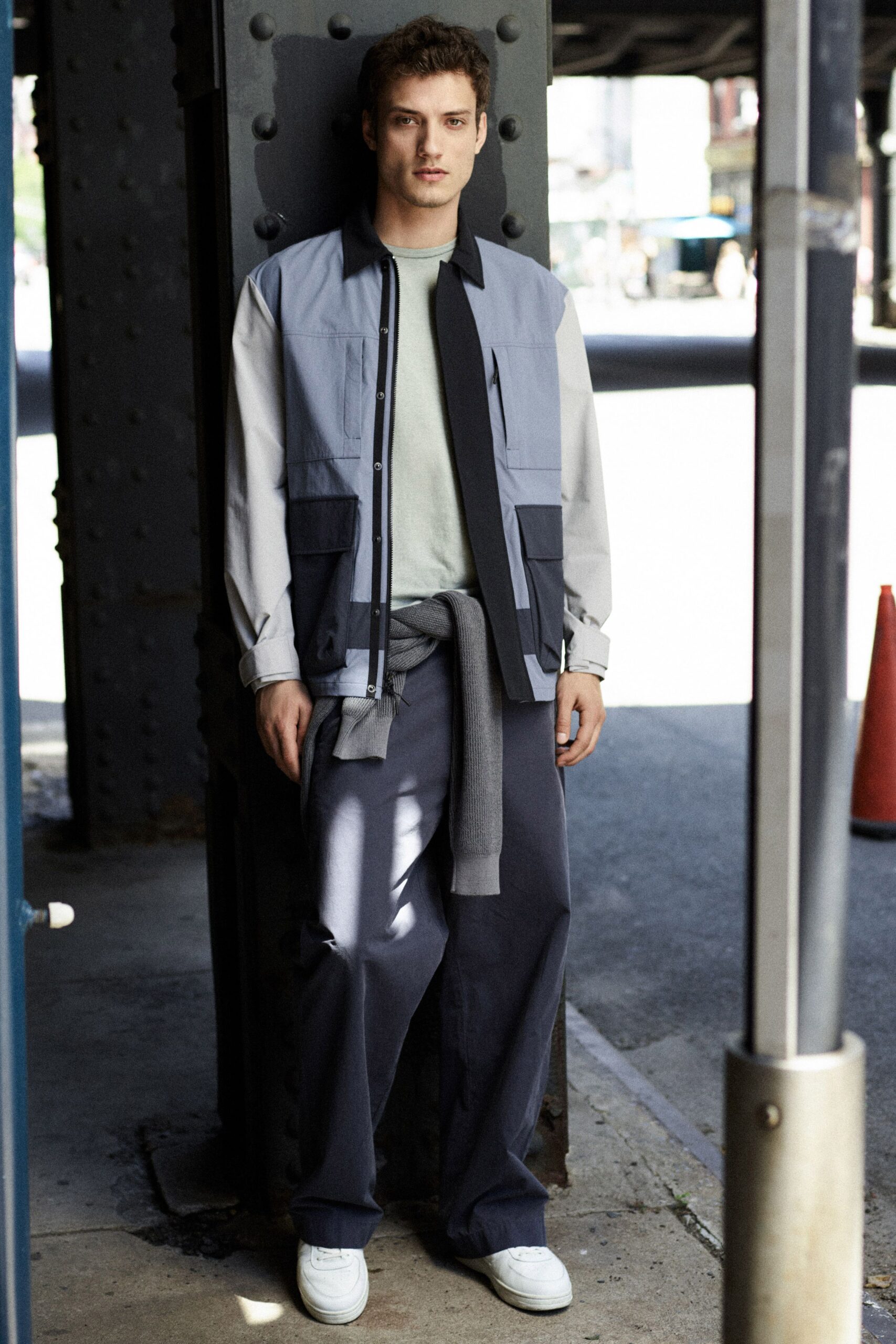 gray jacket green t-shirt navy pants white shoes