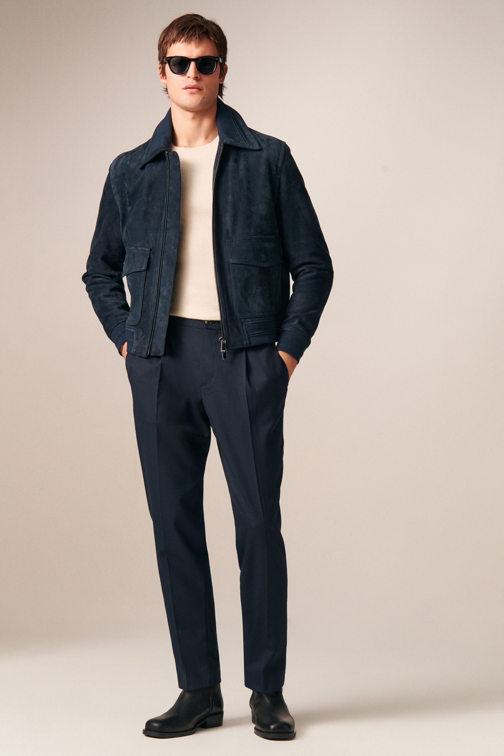 blue suede jacket beige shirt black pants