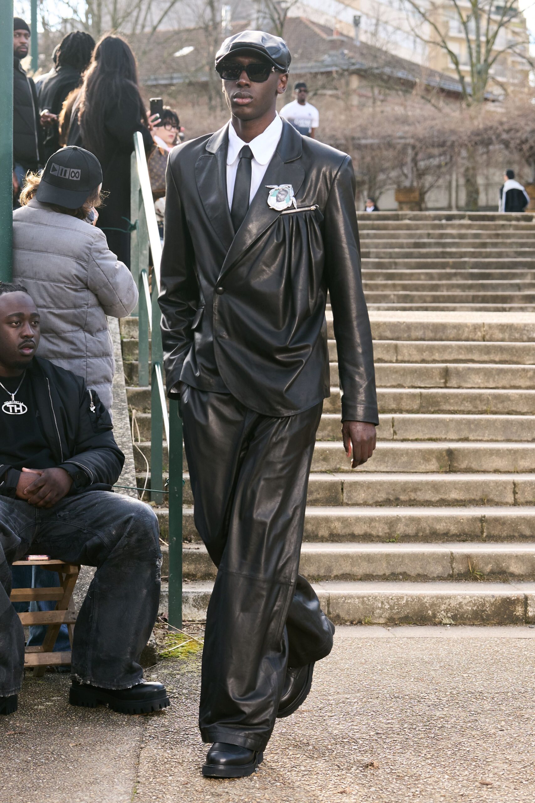 black leather suit with hat