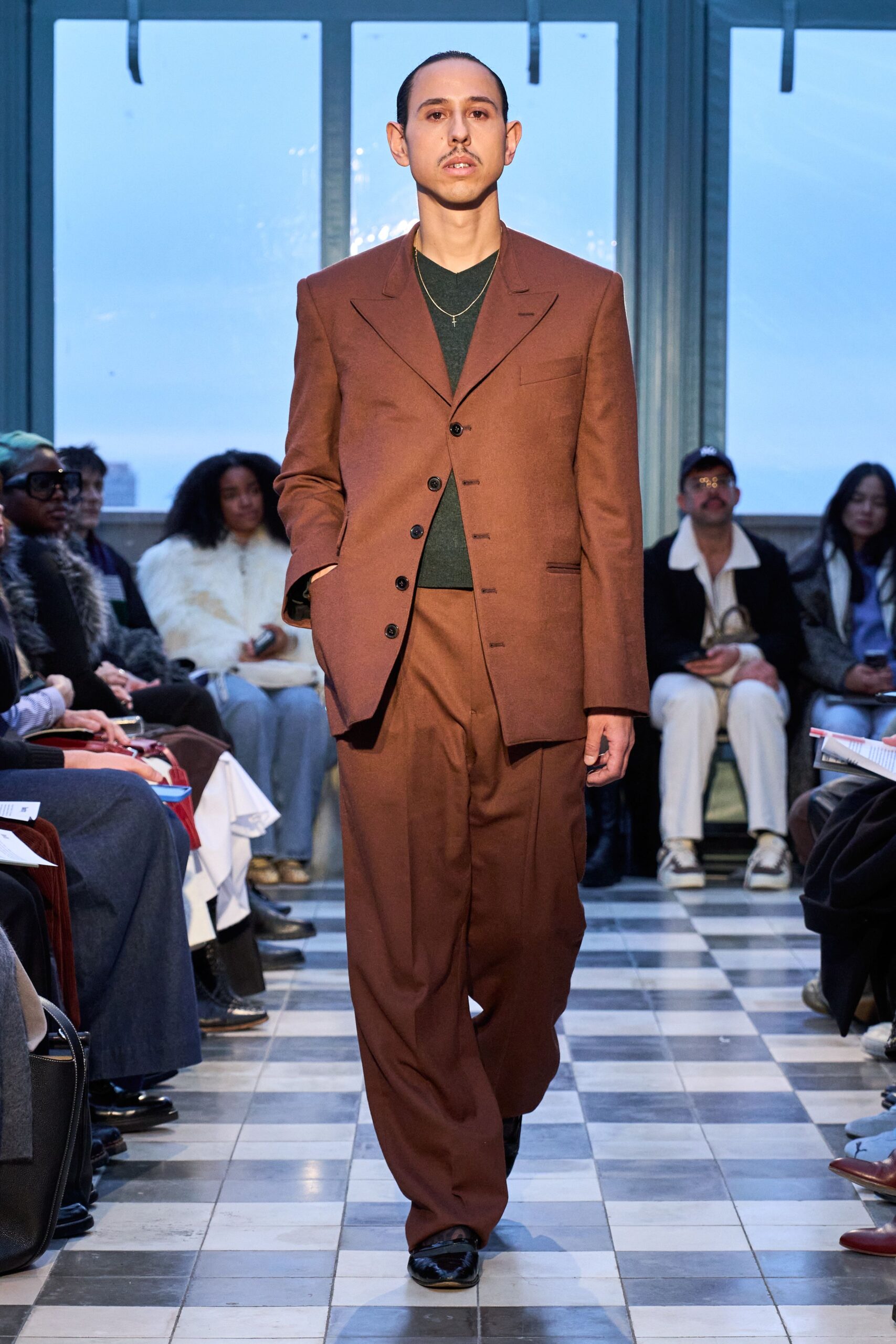 brown tailored suit with green shirt