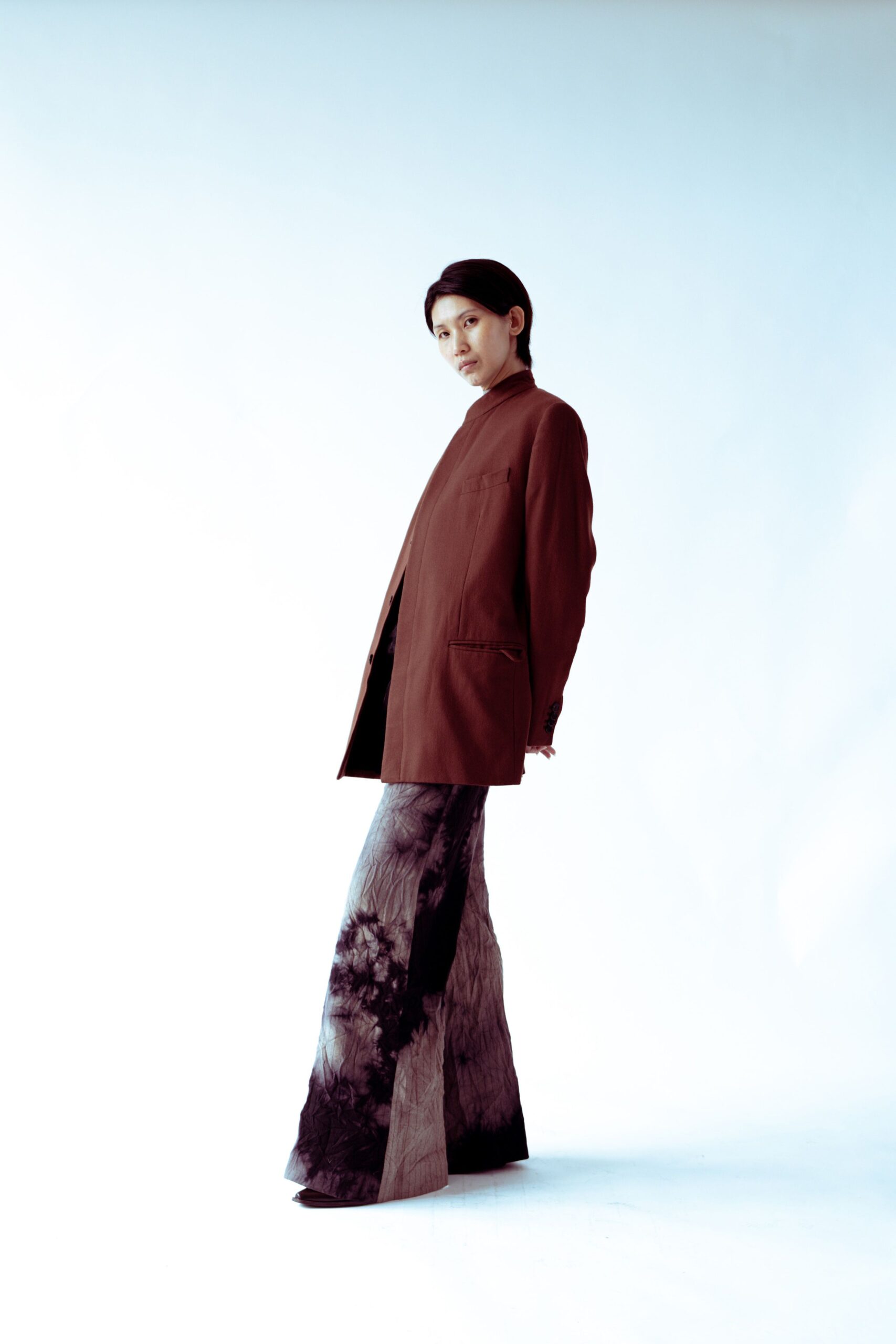brown relaxed jacket with black flared pants