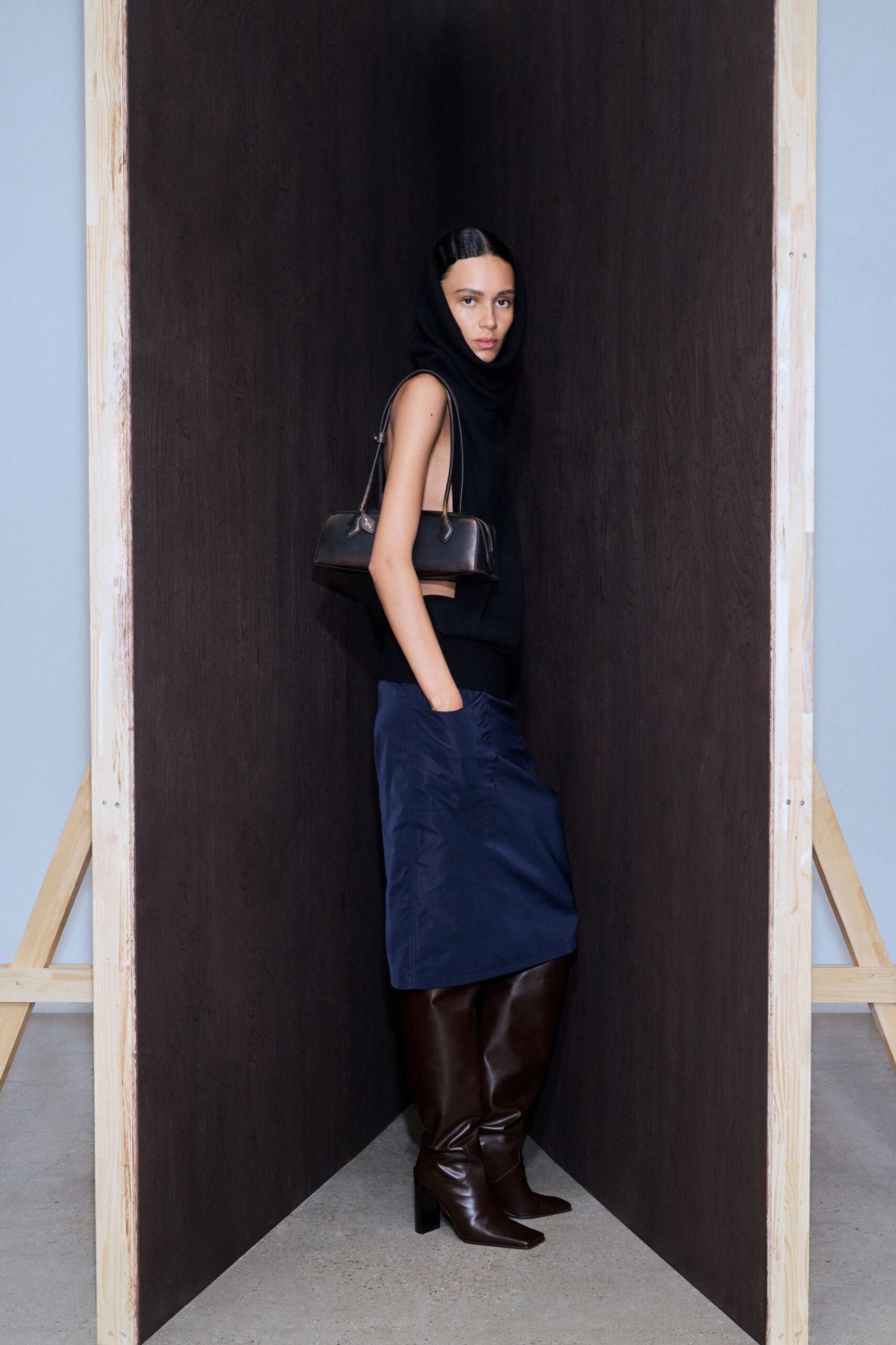 black fitted top blue skirt brown boots
