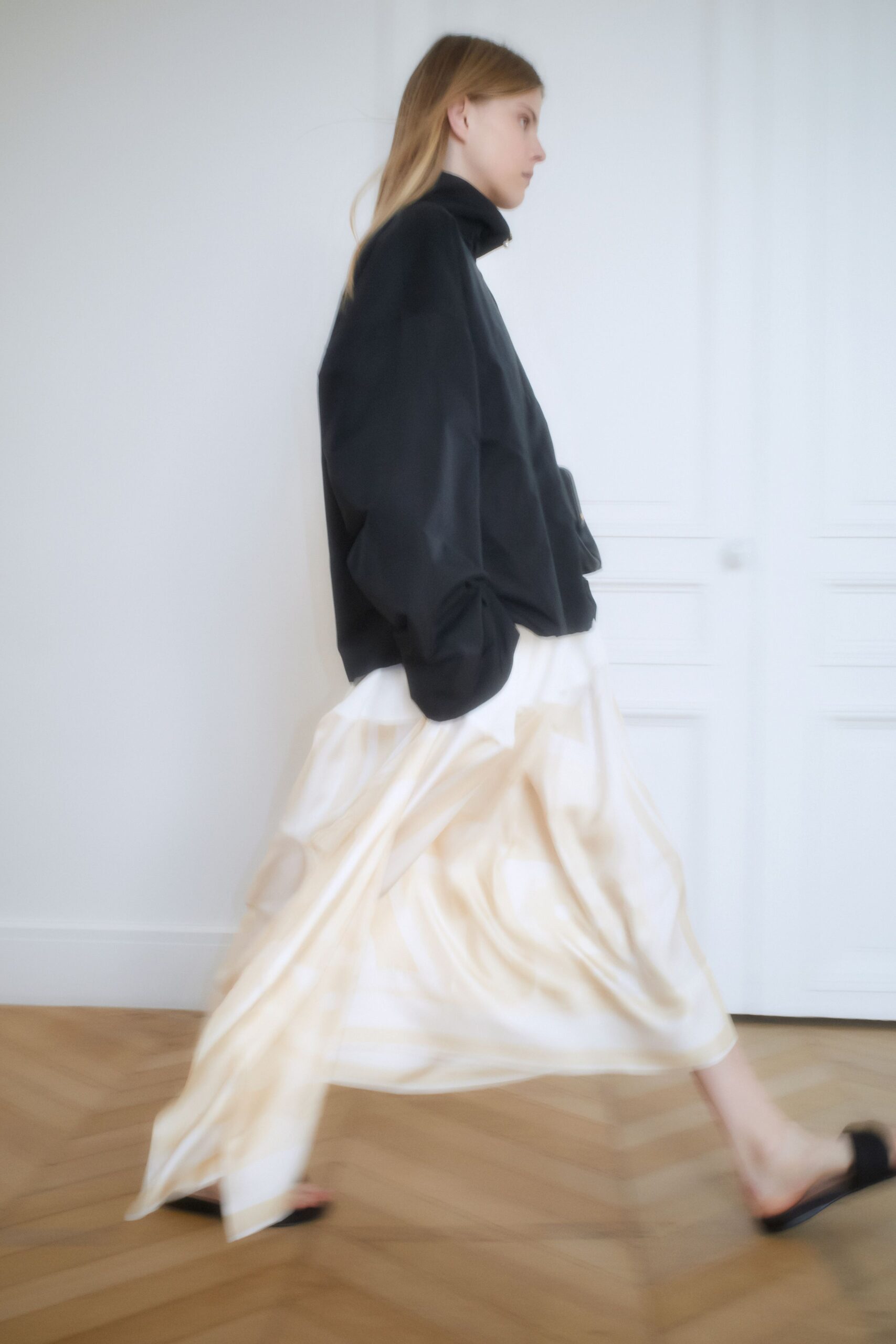 white silk long-sleeve fitted pleated flowing maxi skirt