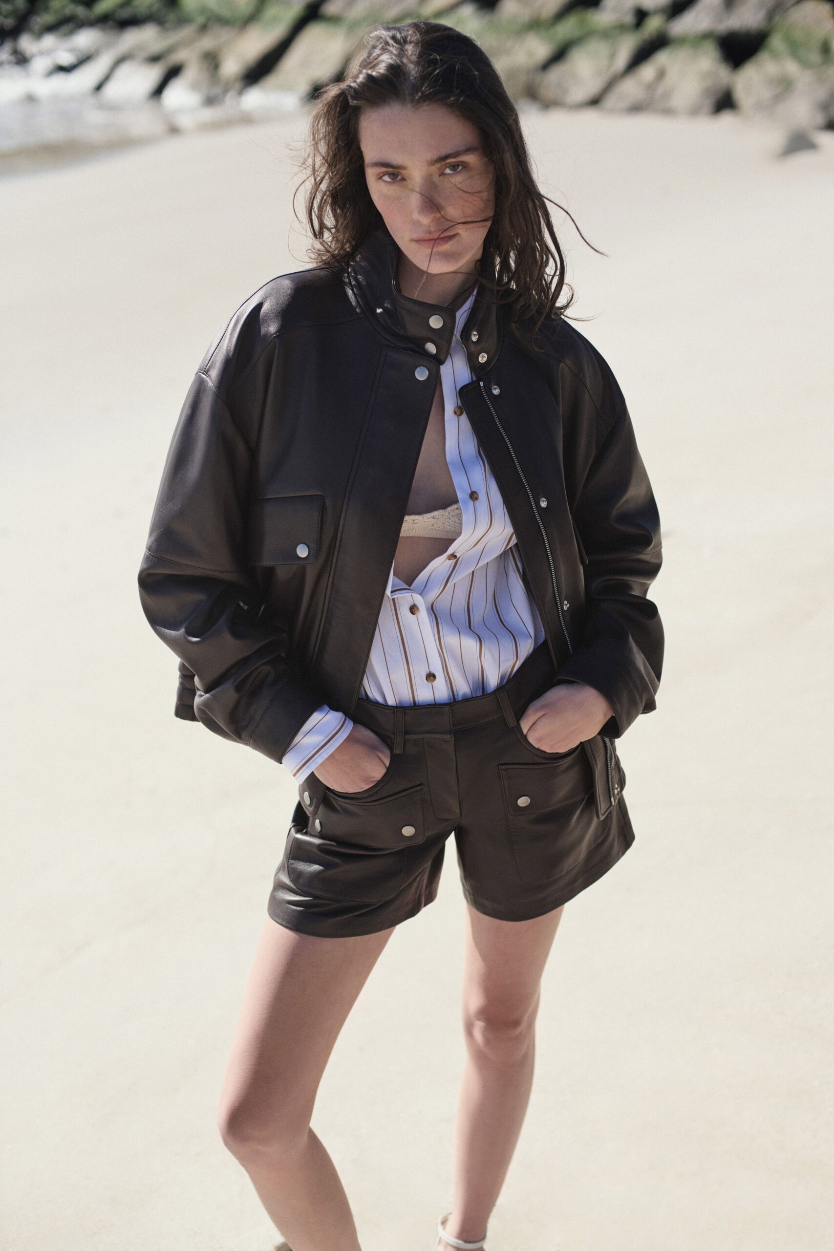 black leather jacket with striped shirt