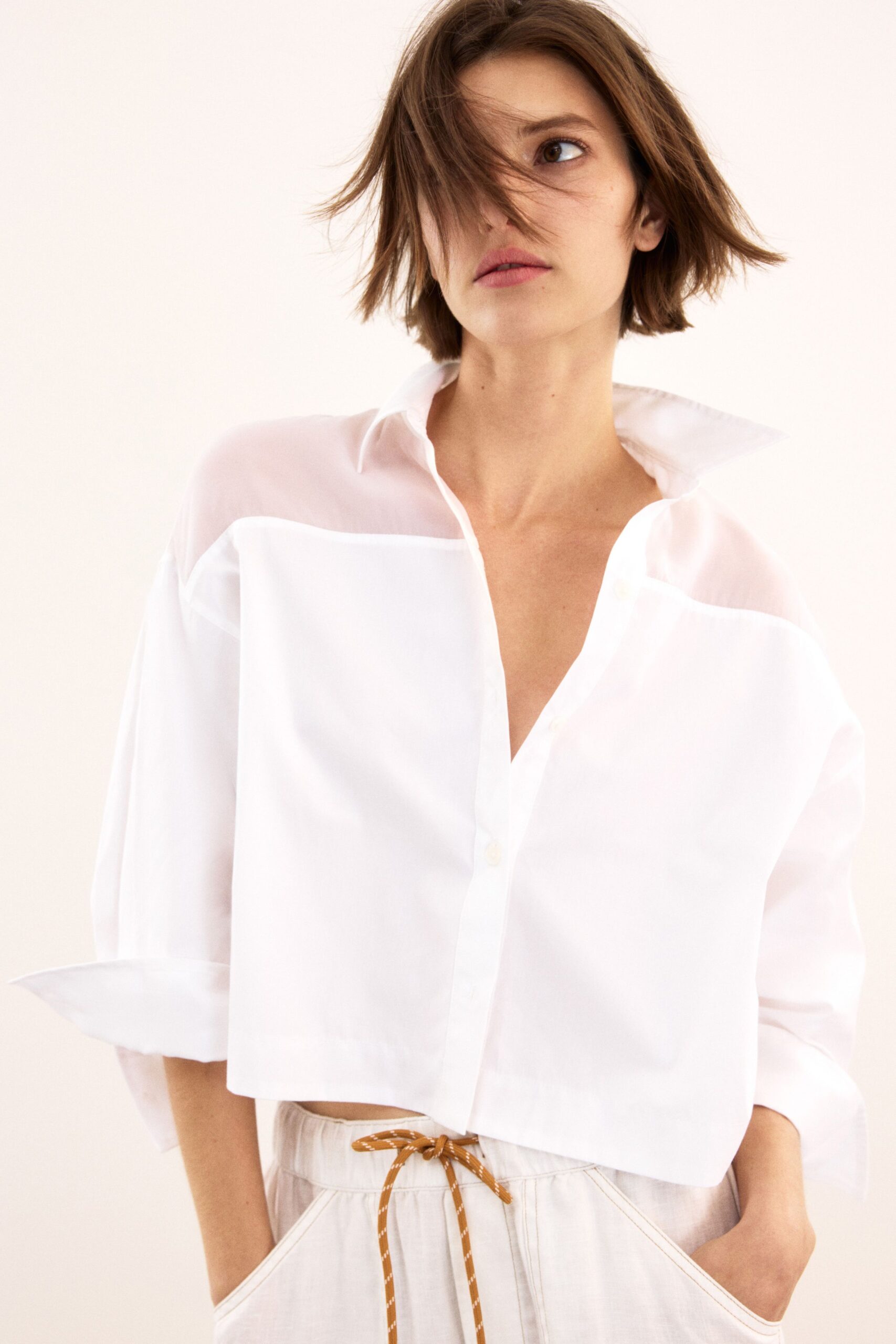 white cotton long-sleeve collared relaxed buttoned sheer shirt