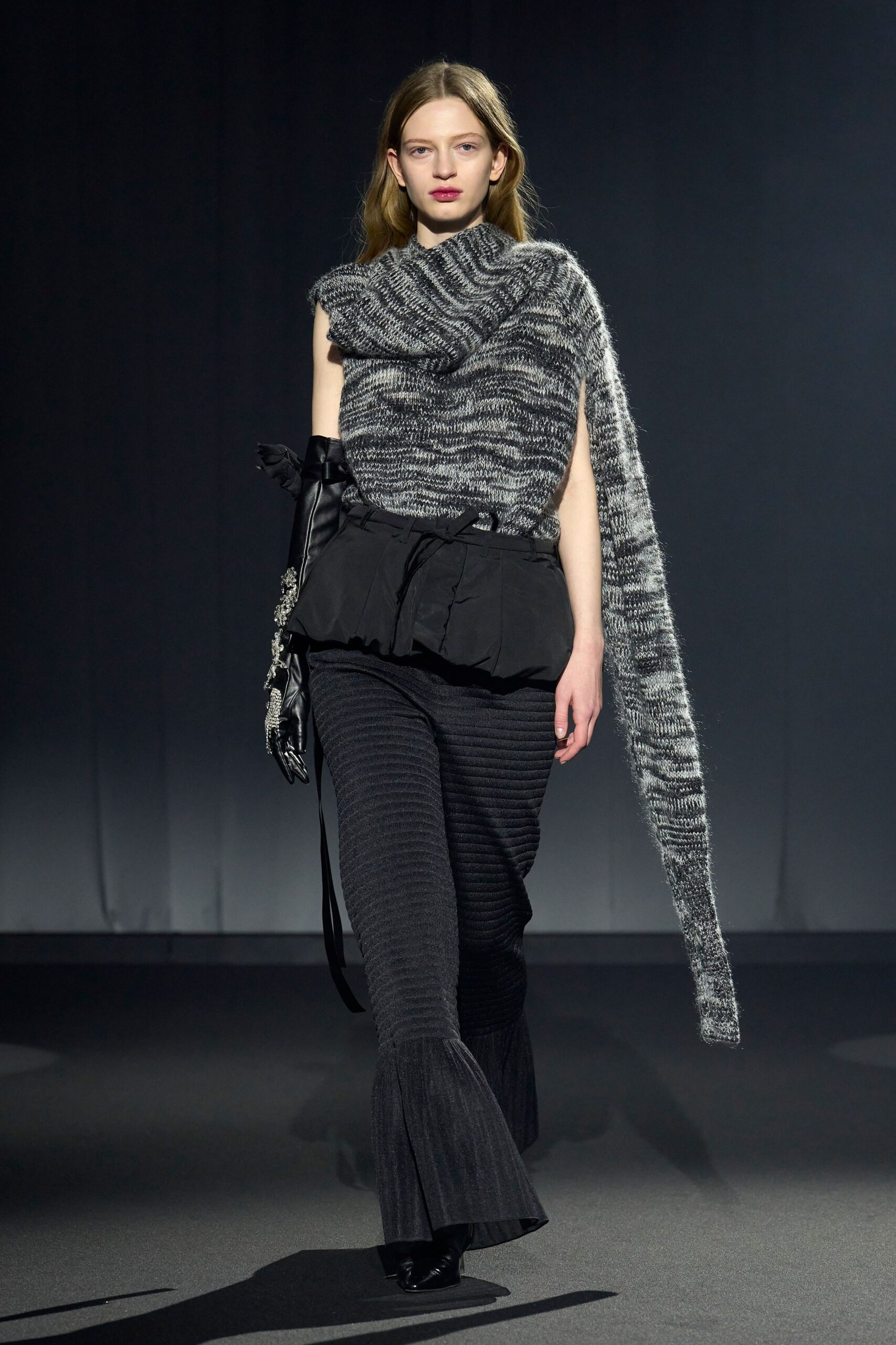 fitted black wool top with flared pants