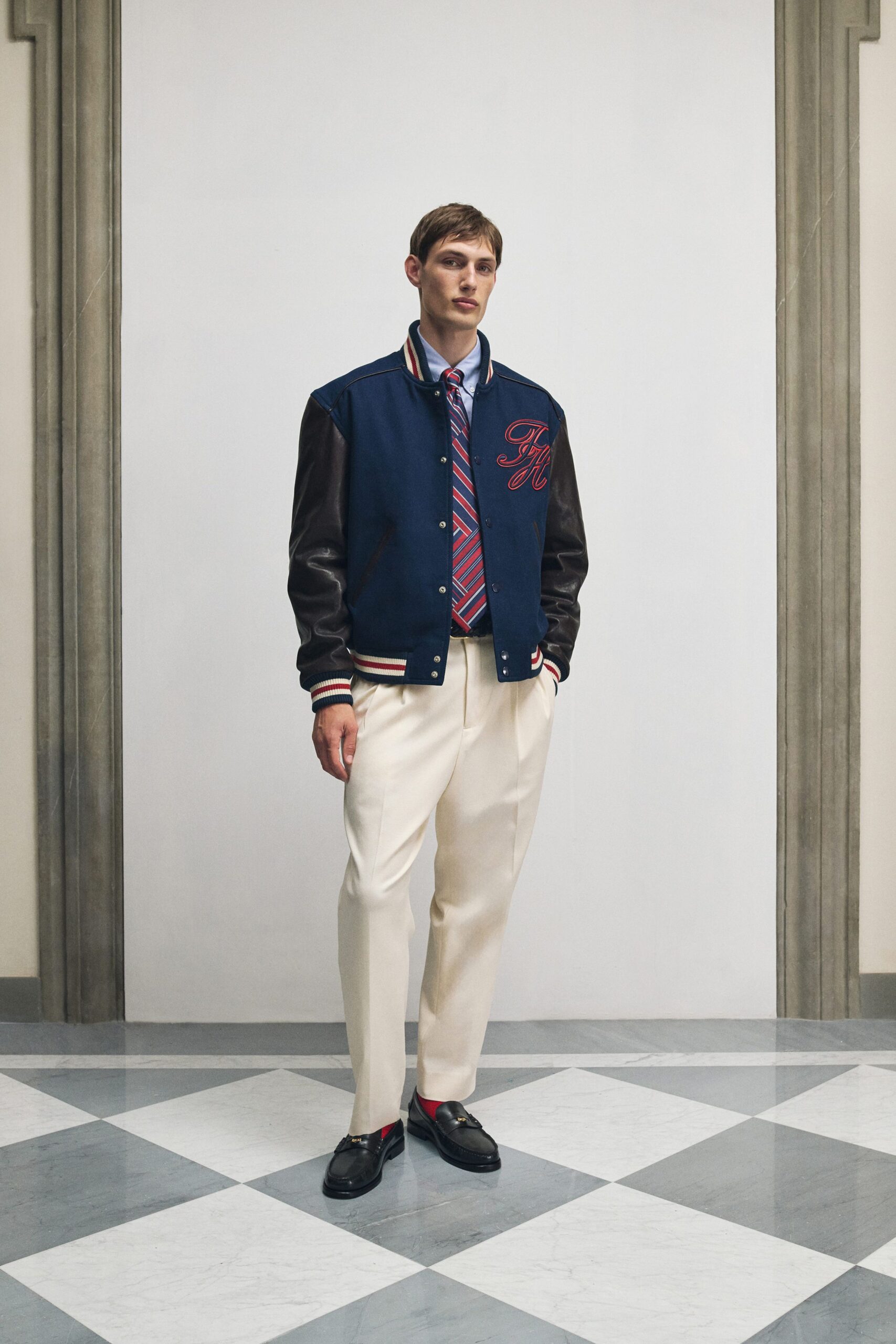 blue jacket white shirt beige pants